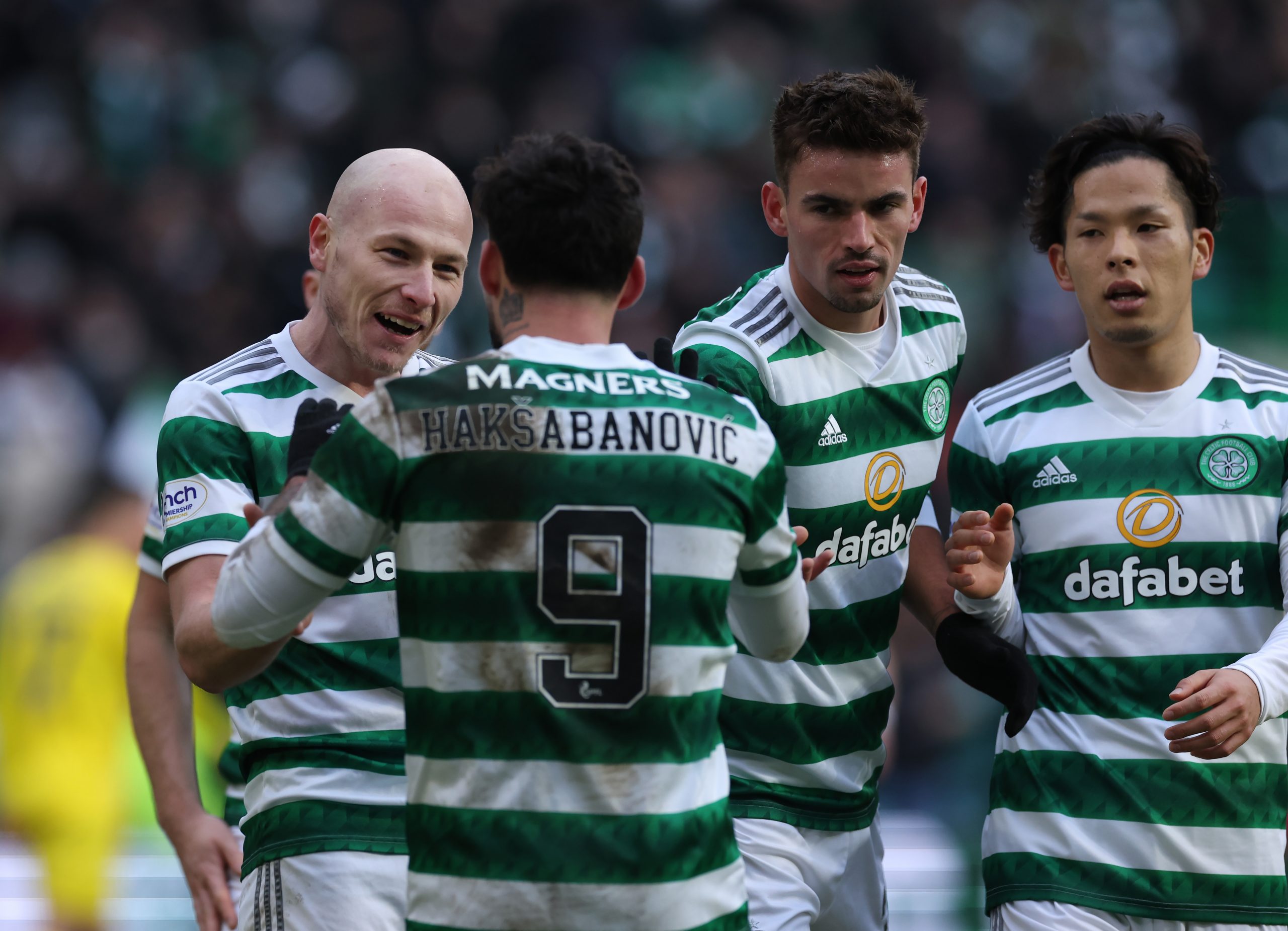 Celtic midfielder Aaron Mooy celebrates a goal