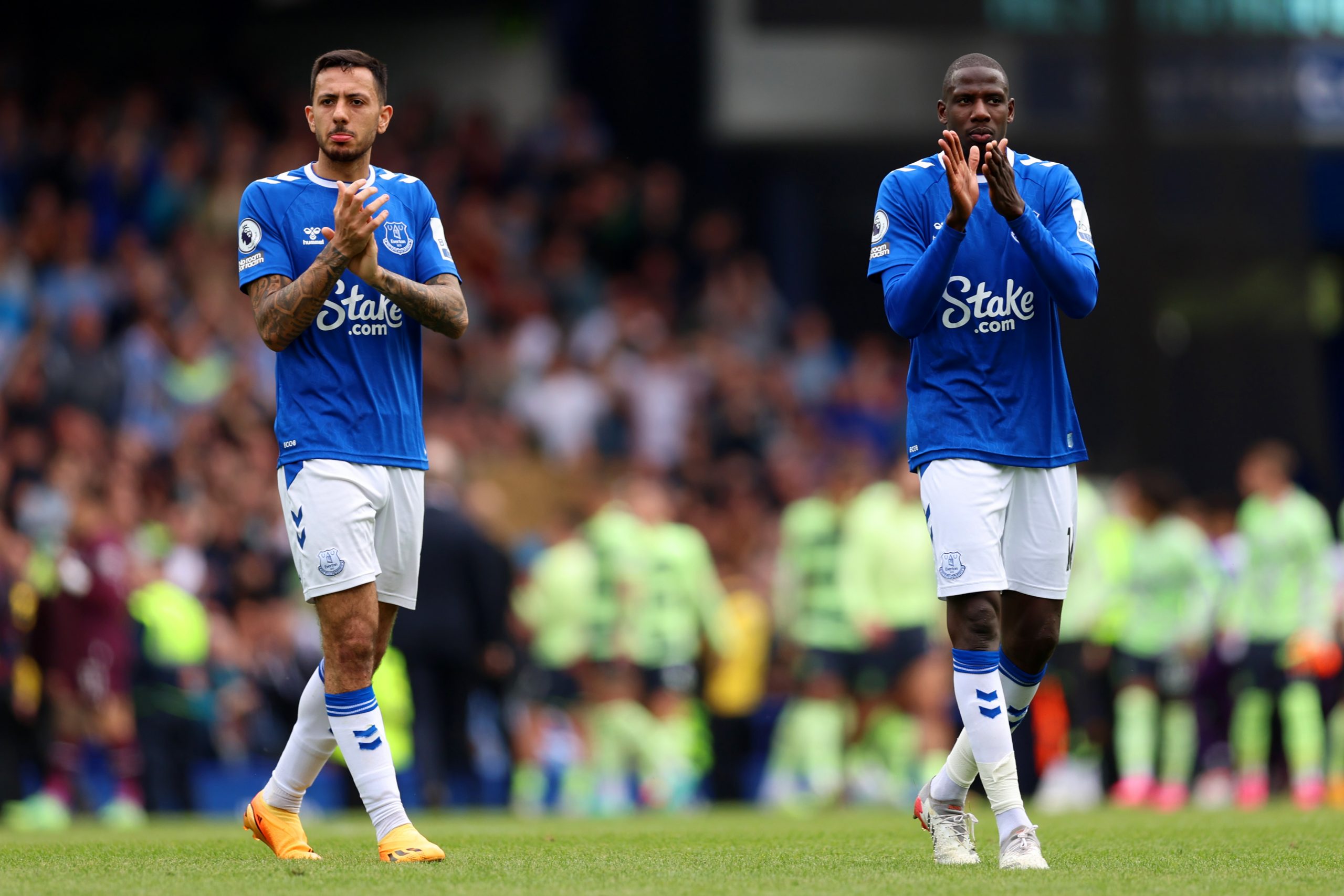 LIVERPOOL, ENGLAND - MAY 14: Dwight McNeil and Abdoulaye Doucoure of Everton applaud the fans after the team's defeat during the Premier League match between Everton FC and Manchester City at Goodison Park on May 14, 2023 in Liverpool, England. (Photo by Clive Brunskill/Getty Images)