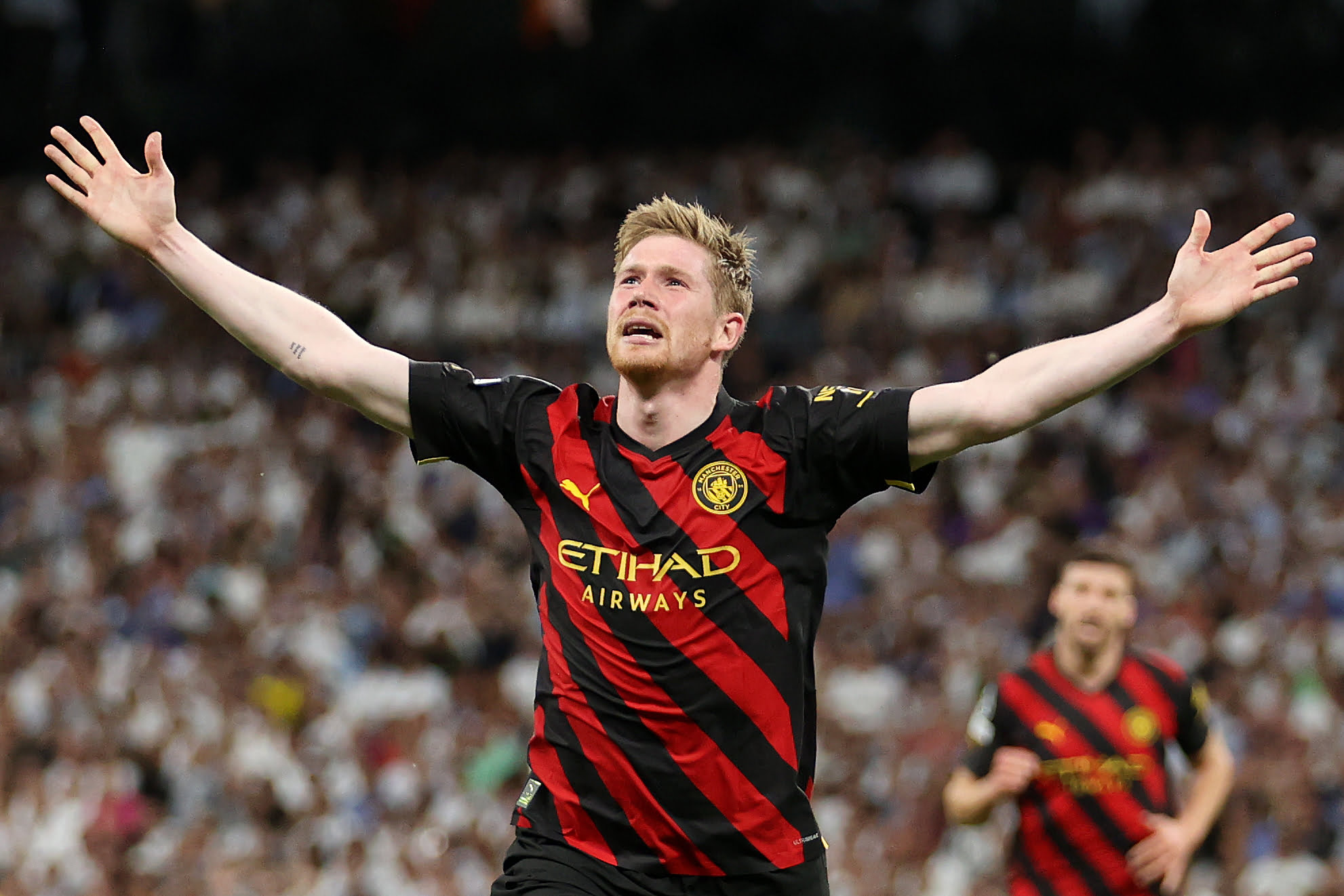 MADRID, SPAIN - MAY 09: Kevin De Bruyne of Manchester City celebrates after scoring the team's first goal during the UEFA Champions League semi-final first leg match between Real Madrid and Manchester City FC at Estadio Santiago Bernabeu on May 09, 2023 in Madrid, Spain. (Photo by Julian Finney/Getty Images)