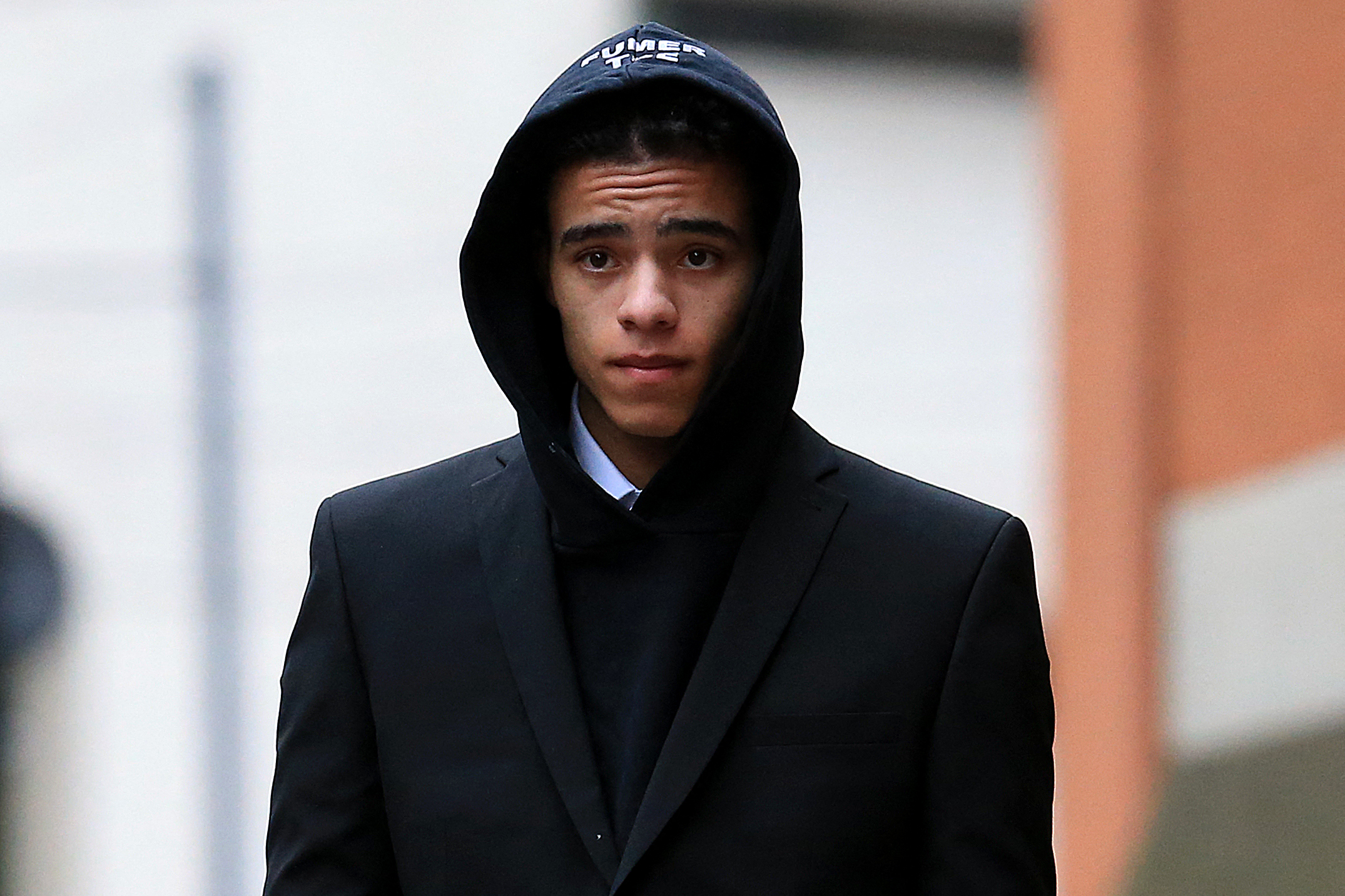 England and Manchester United footballer Mason Greenwood leaves Minshull Street Crown Court in Manchester on November 21, 2022 after a preliminary hearing on charges of attempted rape, controlling and coercive behaviour, and assault. - The 21-year-old was first arrested in January over allegations relating to a young woman after images and videos were posted online. All three charges relate to the same complainant. (Photo by Lindsey Parnaby / AFP) (Photo by LINDSEY PARNABY/AFP via Getty Images)