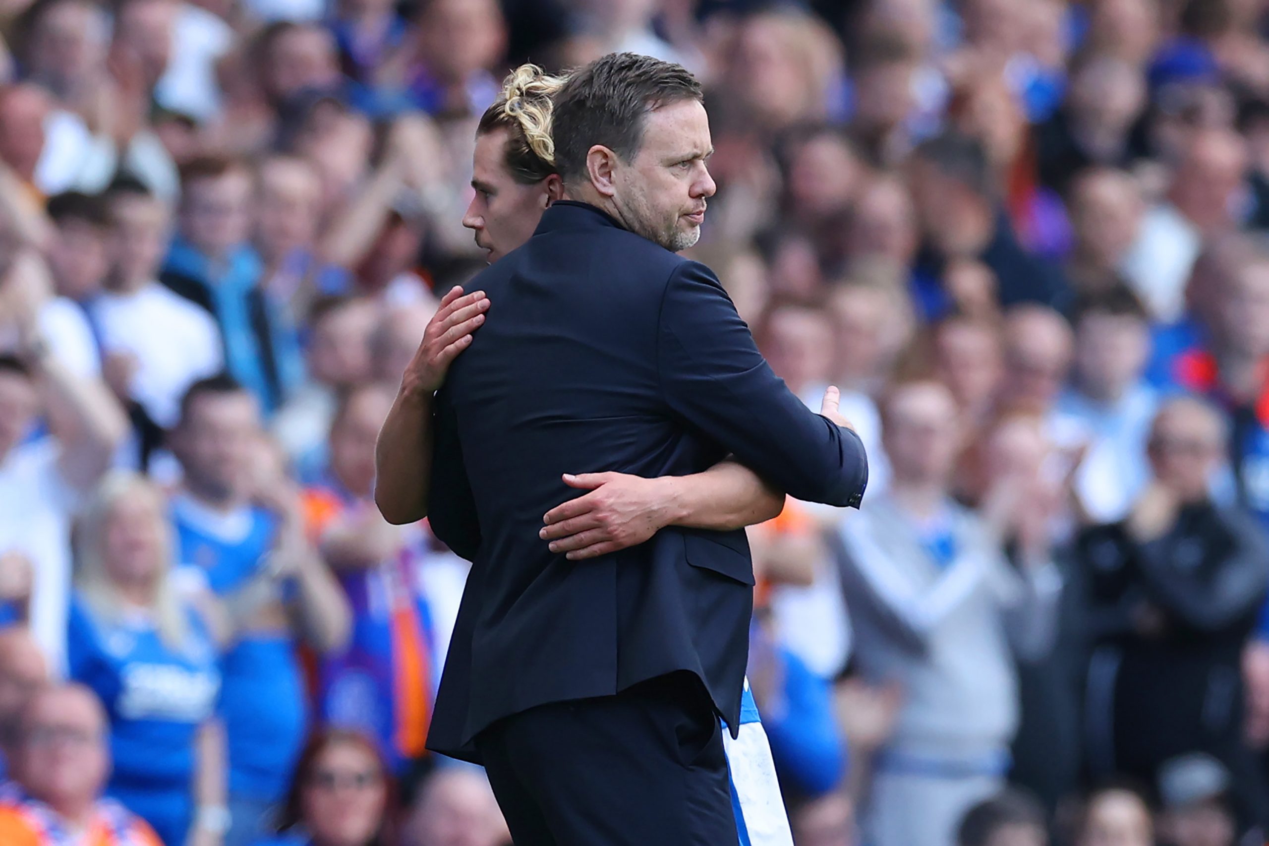 GLASGOW, SCOTLAND - MAY 13: Michael Beale embraces Todd Cantwell of Rangers FC as they are substituted off during the Cinch Premiership match between Rangers and Celtic at Ibrox Stadium on May 13, 2023 in Glasgow, Scotland. (Photo by Ian MacNicol/Getty Images)