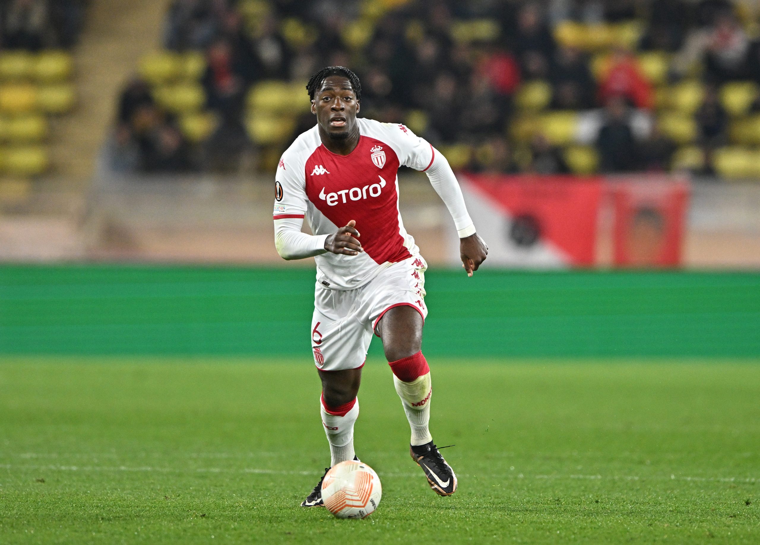 MONACO, MONACO - FEBRUARY 23: Axel Disasi of AS Monaco runs with the ball during the UEFA Europa League knockout round play-off leg two match between AS Monaco and Bayer 04 Leverkusen at Stade Louis II on February 23, 2023 in Monaco, Monaco. (Photo by Chris Ricco/Getty Images)
