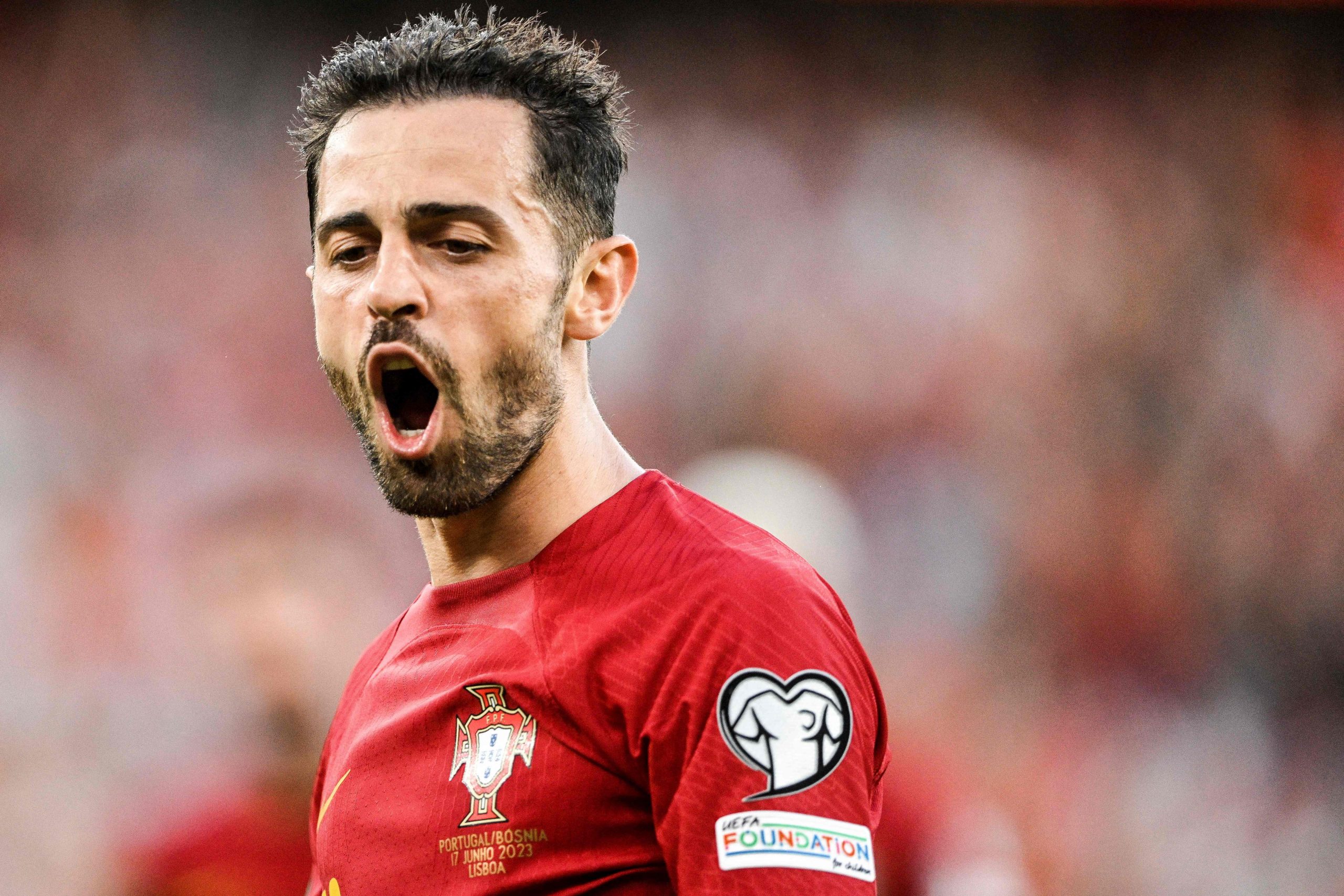 Portugal's midfielder Bernardo Silva celebrates after scoring his team's first goal during the UEFA Euro 2024 group J qualification football match between Portugal and Bosnia-Herzegovina at the Luz stadium in Lisbon on June 17, 2023. (Photo by Patricia DE MELO MOREIRA / AFP) (Photo by PATRICIA DE MELO MOREIRA/AFP via Getty Images)