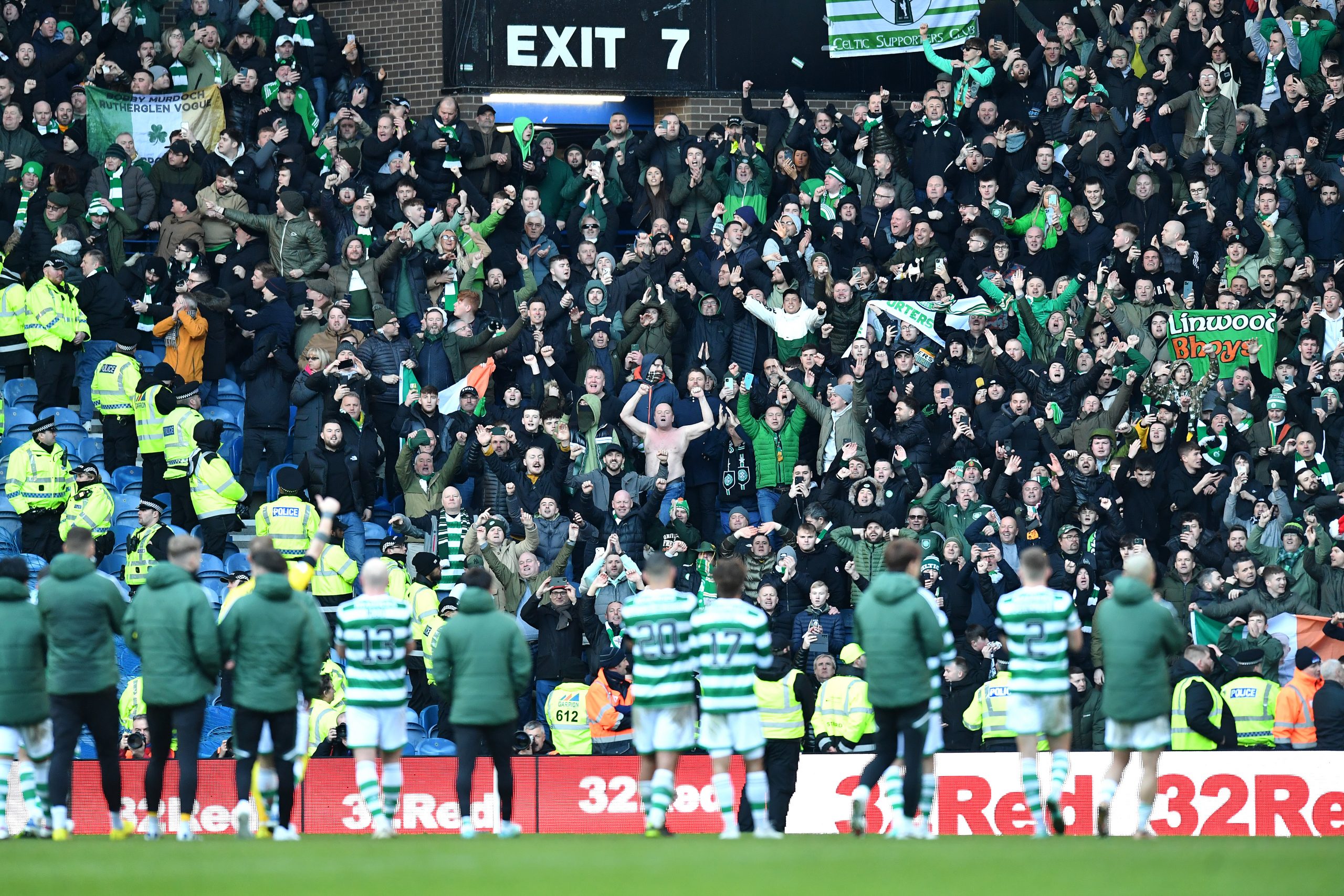 Celtic players applauding the Celtic fans in an Old Firm