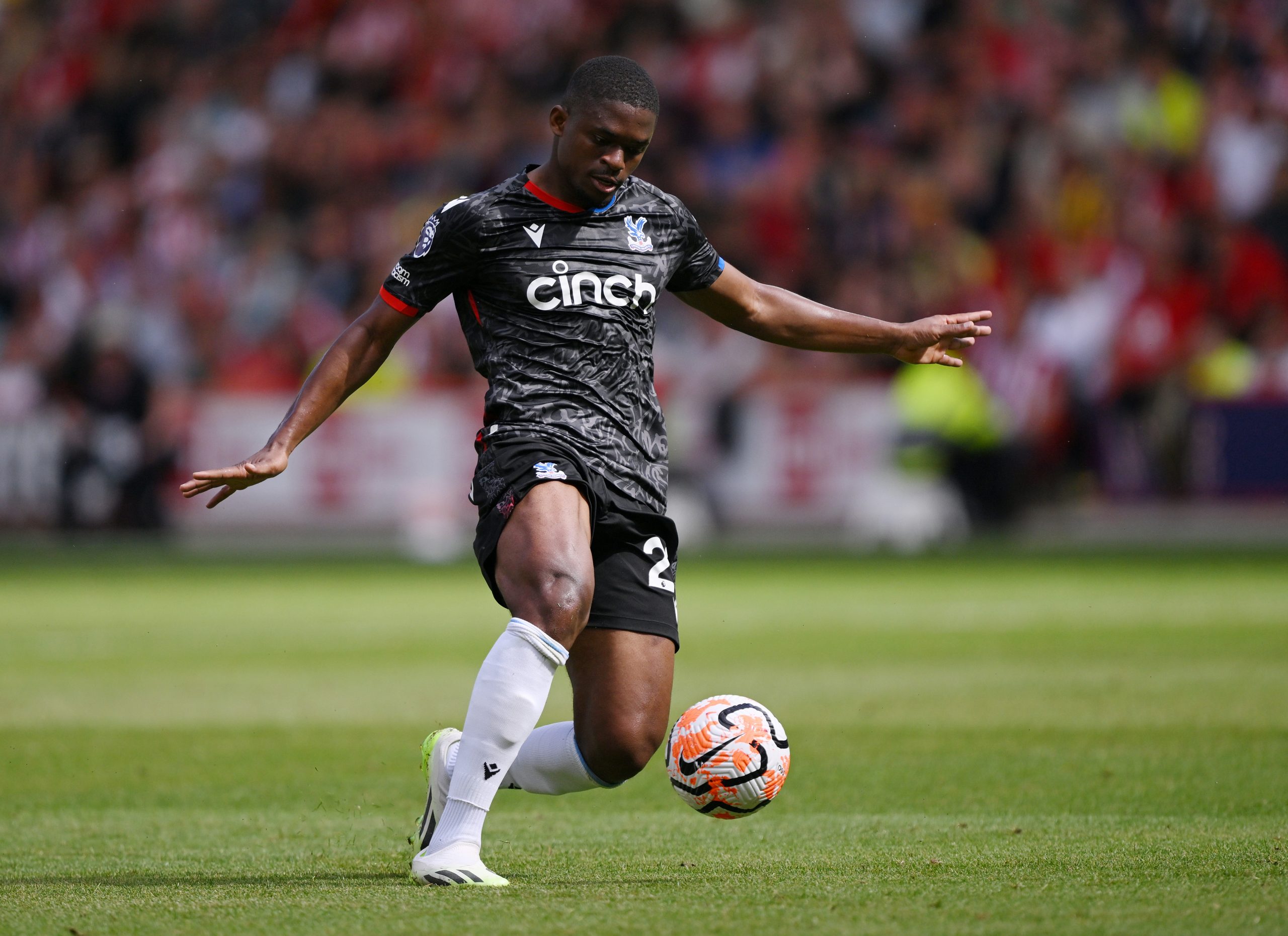 SHEFFIELD, ENGLAND - AUGUST 12: Cheick Doucoure of Crystal Palace runs with the ball during the Premier League match between Sheffield United and Crystal Palace at Bramall Lane on August 12, 2023 in Sheffield, England. (Photo by Laurence Griffiths/Getty Images)