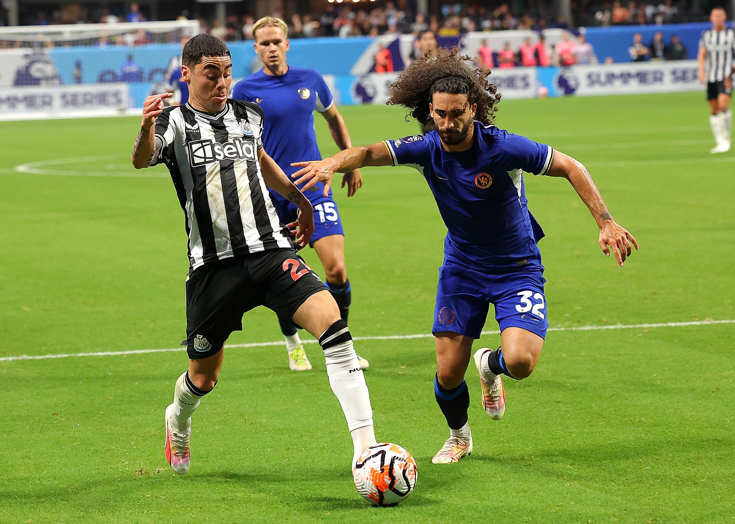 ATLANTA, GEORGIA - JULY 26:  Miguel Almirón #24 of Newcastle United presses the ball against Marc Cucurella #32 of Chelsea during the first half at Mercedes-Benz Stadium on July 26, 2023 in Atlanta, Georgia. (Photo by Kevin C. Cox/Getty Images for Premier League)