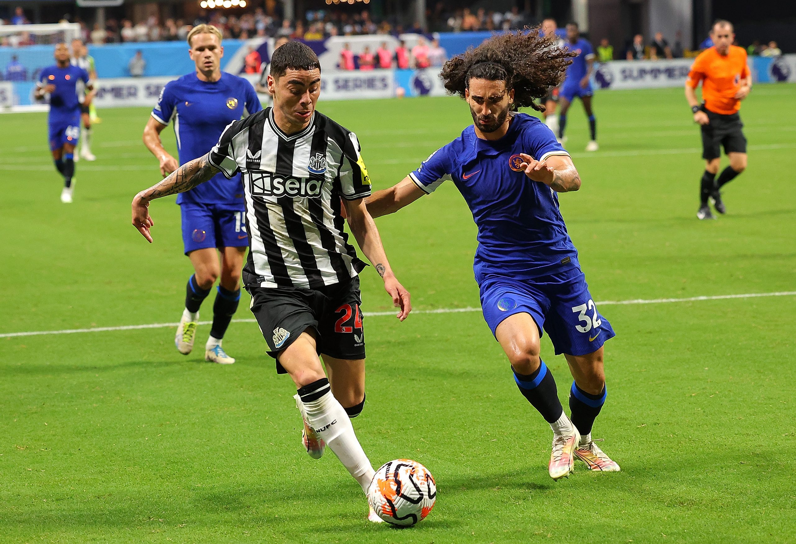 ATLANTA, GEORGIA - JULY 26:  Miguel Almirón #24 of Newcastle United presses the ball against Marc Cucurella #32 of Chelsea during the first half at Mercedes-Benz Stadium on July 26, 2023 in Atlanta, Georgia. (Photo by Kevin C. Cox/Getty Images for Premier League)