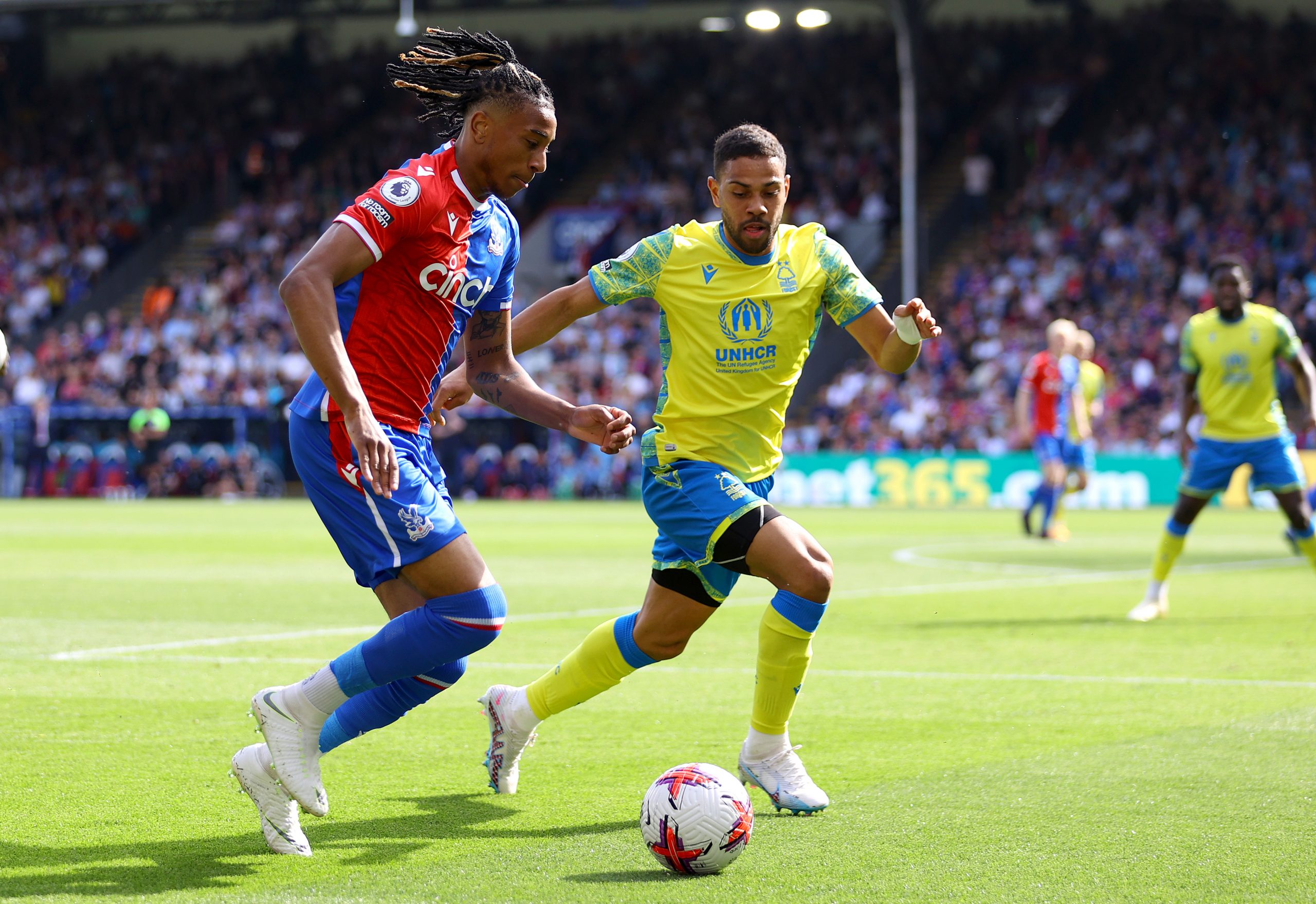 LONDON, ENGLAND - MAY 28: Michael Olise of Crystal Palace and Renan Lodi of Nottingham Forest battle for the ball during the Premier League match between Crystal Palace and Nottingham Forest at Selhurst Park on May 28, 2023 in London, England. (Photo by Richard Heathcote/Getty Images)