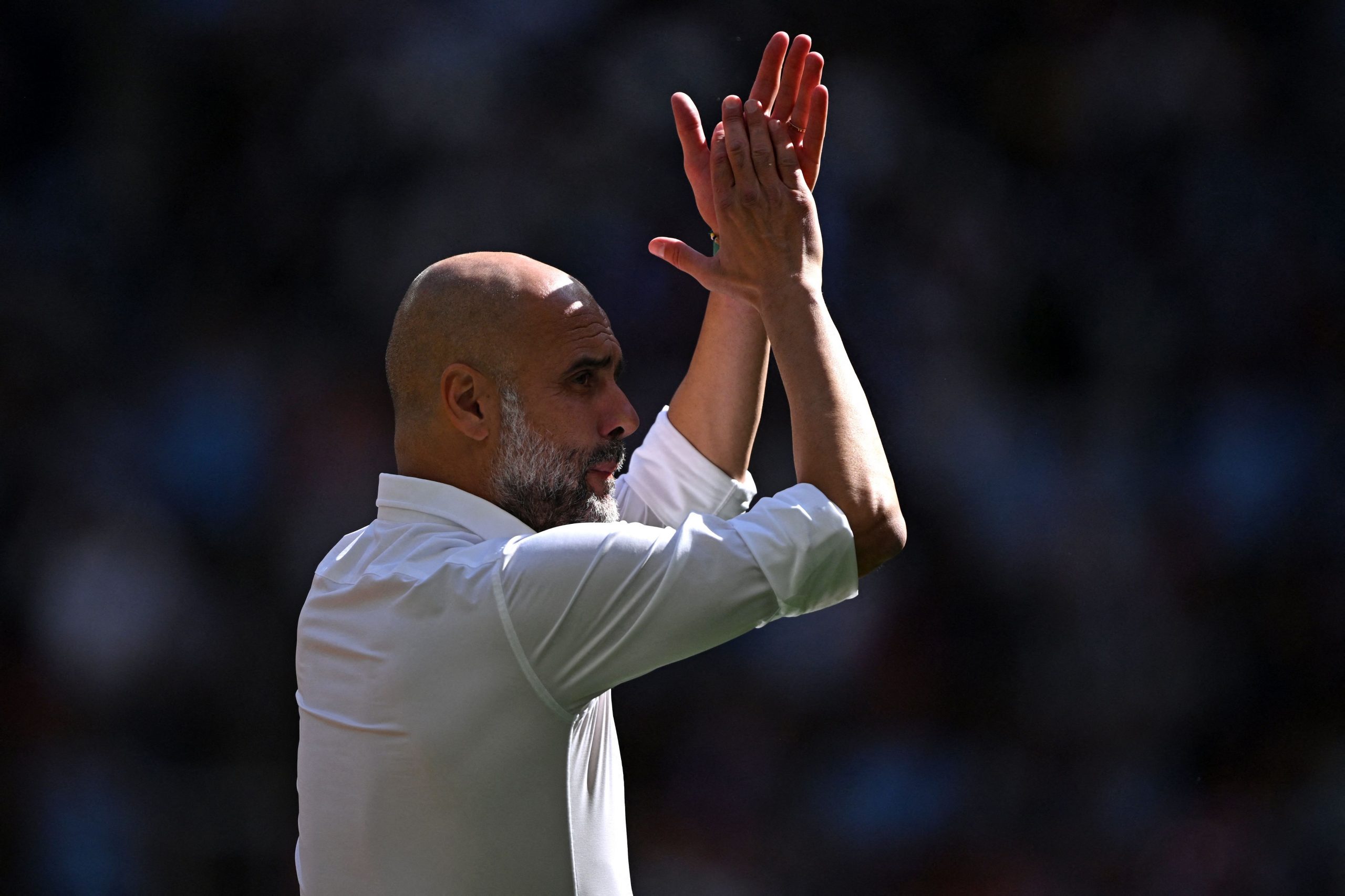 Manchester City's Spanish manager Pep Guardiola applauds ahead of kick-off in the English FA Community Shield football match between Arsenal and Manchester City at Wembley Stadium, in London, August 6, 2023. (Photo by JUSTIN TALLIS / AFP) / NOT FOR MARKETING OR ADVERTISING USE / RESTRICTED TO EDITORIAL USE (Photo by JUSTIN TALLIS/AFP via Getty Images)