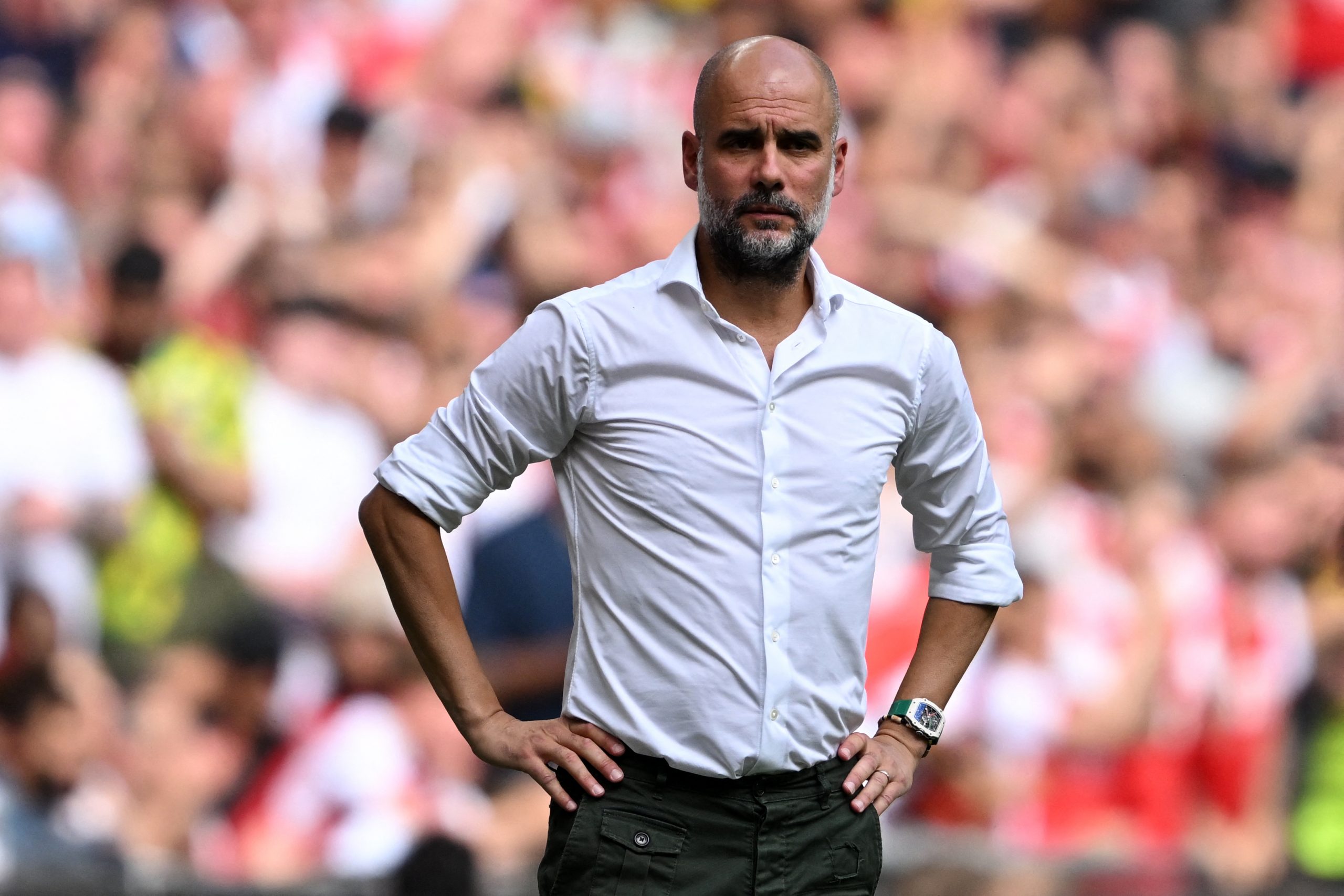 Manchester City's Spanish manager Pep Guardiola looks on during the English FA Community Shield football match between Arsenal and Manchester City at Wembley Stadium, in London, August 6, 2023. (Photo by JUSTIN TALLIS / AFP) / NOT FOR MARKETING OR ADVERTISING USE / RESTRICTED TO EDITORIAL USE (Photo by JUSTIN TALLIS/AFP via Getty Images)