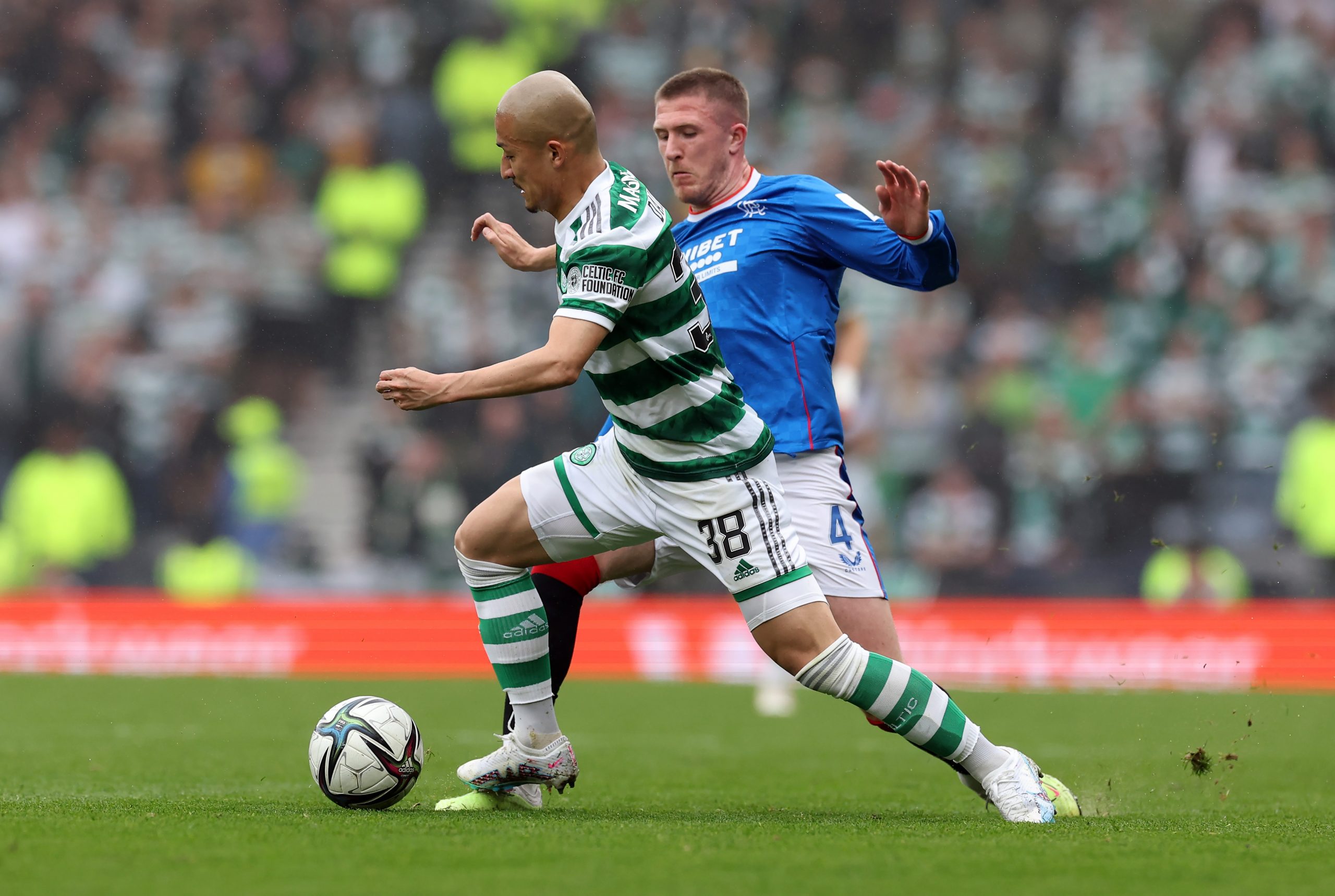 Celtic attacker Daizen Maeda in action against Rangers' John Lundstram