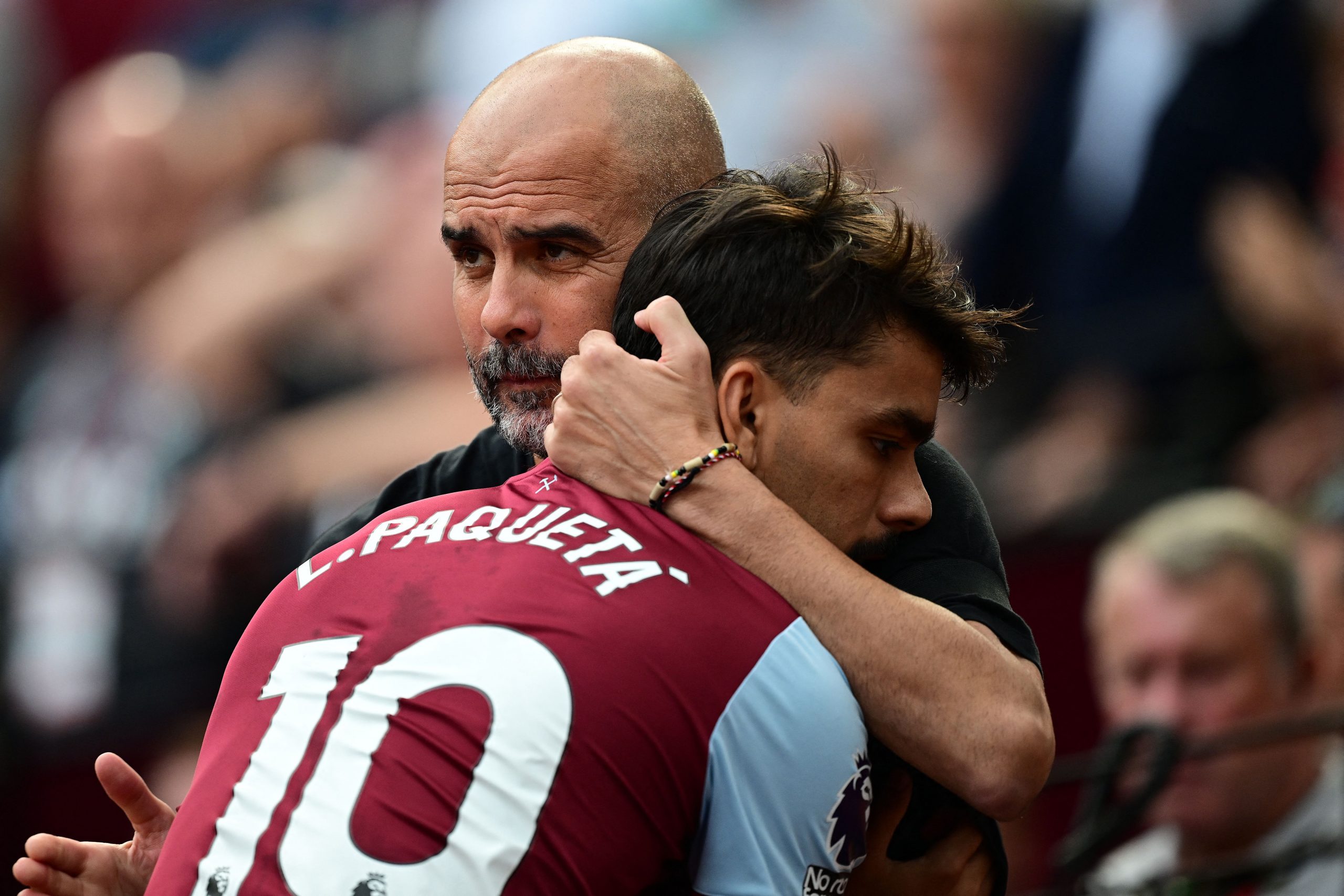 Manchester City's Spanish manager Pep Guardiola greets West Ham United's Brazilian midfielder #10 Lucas Paqueta during the English Premier League football match between West Ham United and Manchester City at the London Stadium, in London on September 16, 2023. (Photo by Ben Stansall / AFP) / RESTRICTED TO EDITORIAL USE. No use with unauthorized audio, video, data, fixture lists, club/league logos or 'live' services. Online in-match use limited to 120 images. An additional 40 images may be used in extra time. No video emulation. Social media in-match use limited to 120 images. An additional 40 images may be used in extra time. No use in betting publications, games or single club/league/player publications. /  (Photo by BEN STANSALL/AFP via Getty Images)