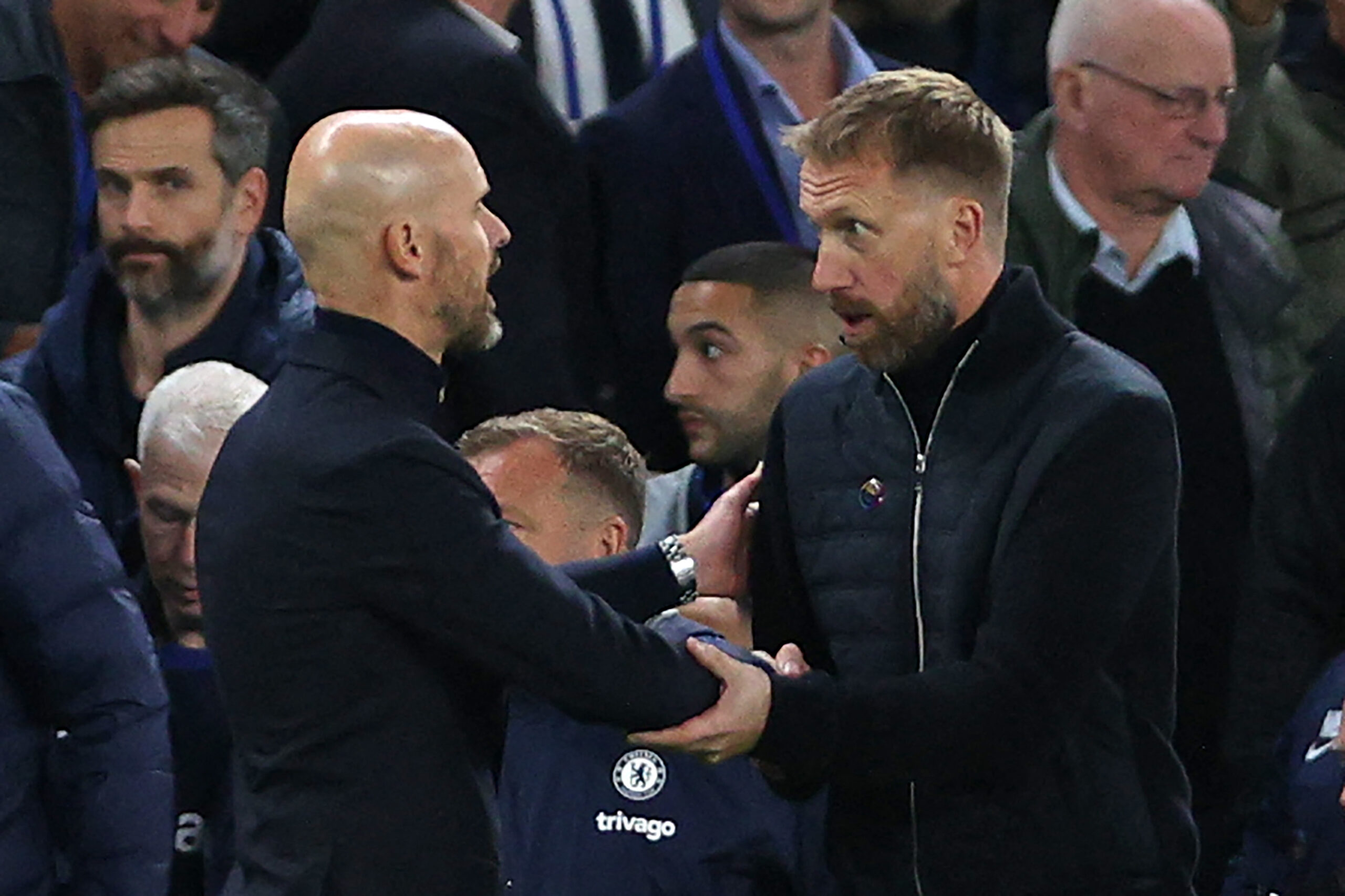 Manchester United's Dutch manager Erik ten Hag (L) and Chelsea's English head coach Graham Potter (R) shake hands after the English Premier League football match between Chelsea and Manchester United at Stamford Bridge in London on October 22, 2022. - RESTRICTED TO EDITORIAL USE. No use with unauthorized audio, video, data, fixture lists, club/league logos or 'live' services. Online in-match use limited to 120 images. An additional 40 images may be used in extra time. No video emulation. Social media in-match use limited to 120 images. An additional 40 images may be used in extra time. No use in betting publications, games or single club/league/player publications. (Photo by ADRIAN DENNIS / AFP) / RESTRICTED TO EDITORIAL USE. No use with unauthorized audio, video, data, fixture lists, club/league logos or 'live' services. Online in-match use limited to 120 images. An additional 40 images may be used in extra time. No video emulation. Social media in-match use limited to 120 images. An additional 40 images may be used in extra time. No use in betting publications, games or single club/league/player publications. / RESTRICTED TO EDITORIAL USE. No use with unauthorized audio, video, data, fixture lists, club/league logos or 'live' services. Online in-match use limited to 120 images. An additional 40 images may be used in extra time. No video emulation. Social media in-match use limited to 120 images. An additional 40 images may be used in extra time. No use in betting publications, games or single club/league/player publications. (Photo by ADRIAN DENNIS/AFP via Getty Images)