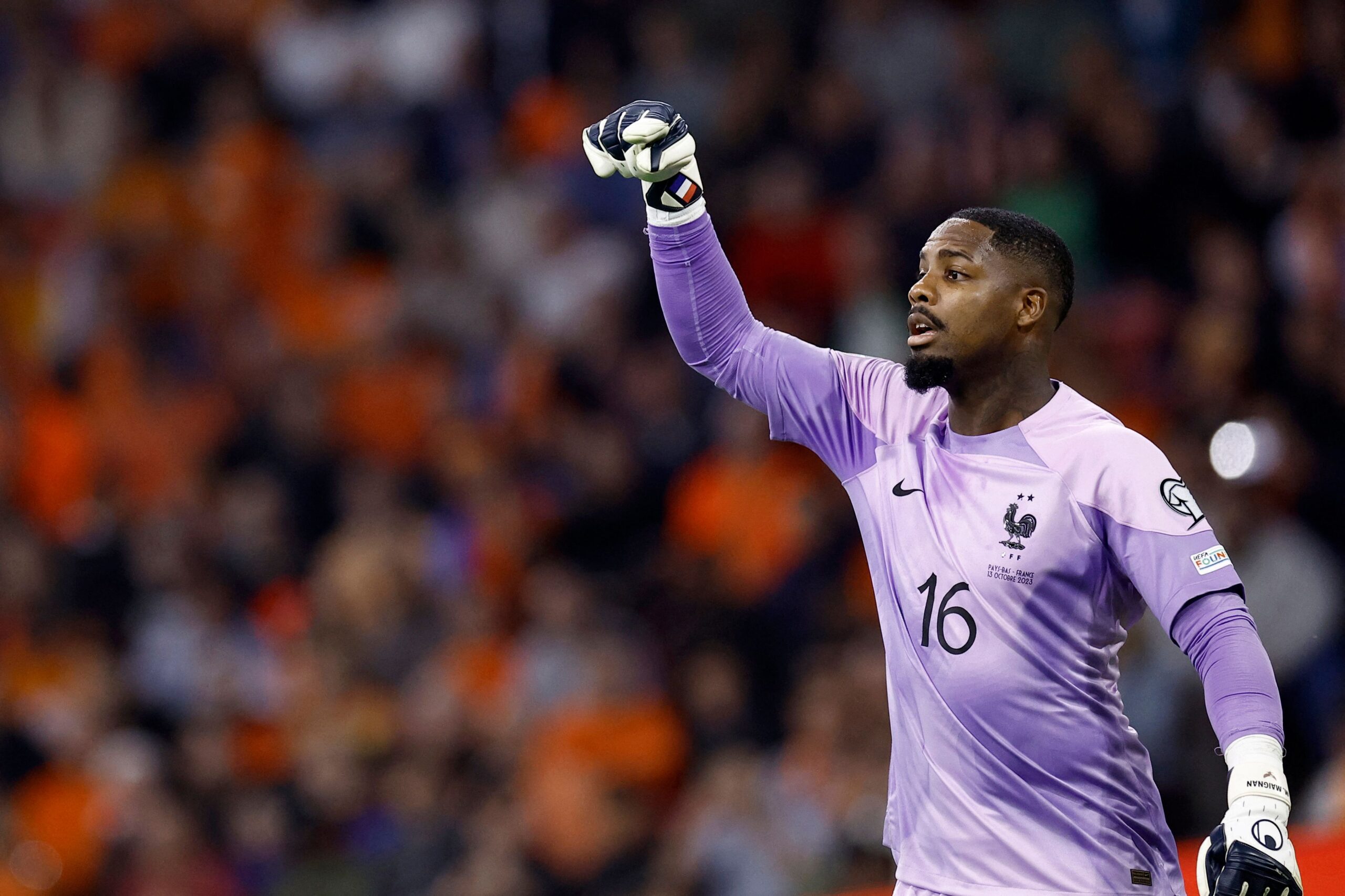 France's goalkeeper Mike Maignan gestures during the Euro 2024 qualifying football match between the Netherlands and France at the Johan Cruijff ArenA in Amsterdam on October 13, 2023. (Photo by KENZO TRIBOUILLARD / AFP) (Photo by KENZO TRIBOUILLARD/AFP via Getty Images)