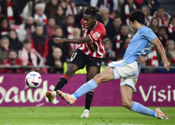 Athletic Bilbao's Spanish forward #11 Nico Williams is tackled by Celta Vigo's Spanish midfielder #23 Manu Sanchez as he attempts to score during the Spanish league football match between Athletic Club Bilbao and RC Celta de Vigo at the San Mames stadium in Bilbao on November 10, 2023. (Photo by ANDER GILLENEA / AFP) (Photo by ANDER GILLENEA/AFP via Getty Images)