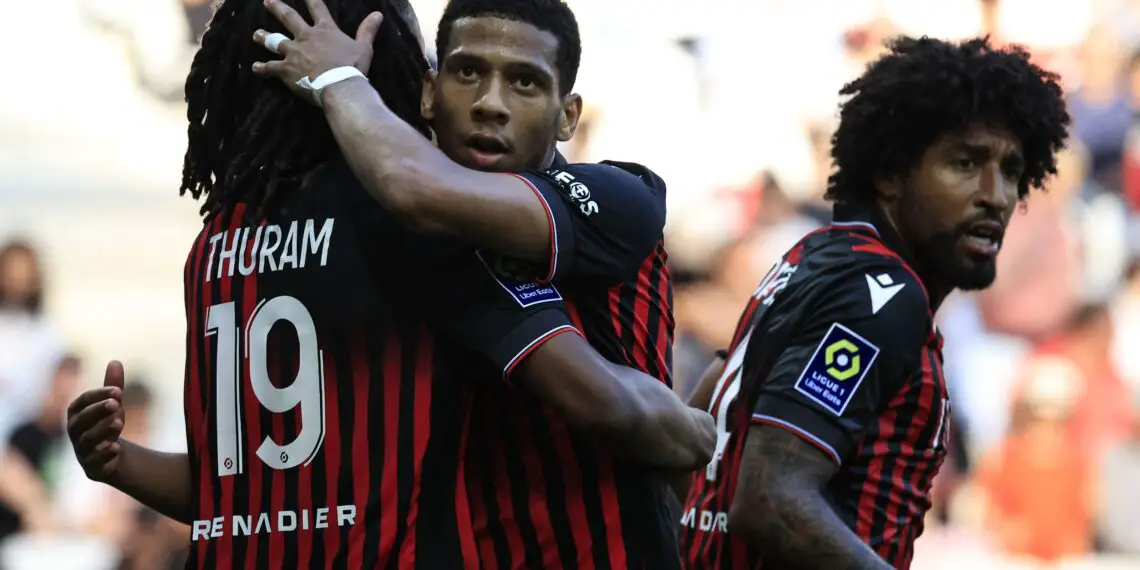 Nice's French defender Jean-Clair Todibo (C)  embraces Nice's French midfielder Khephren Thuram (L) after the French L1 football match between OGC Nice and FC Rennes at the Allianz Riviera Stadium in Nice, south-eastern France, on May 6, 2023. (Photo by Valery HACHE / AFP) (Photo by VALERY HACHE/AFP via Getty Images)