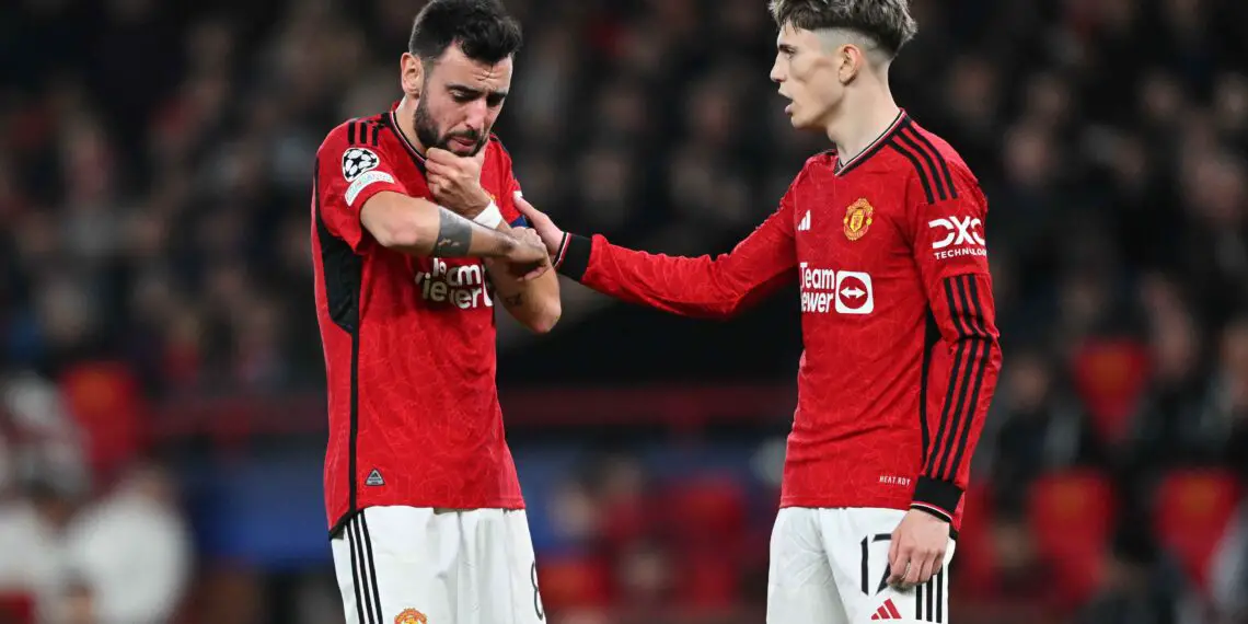 MANCHESTER, ENGLAND - DECEMBER 12: Bruno Fernandes of Manchester United reacts after a collision with Dayot Upamecano of Bayern Munich (not pictured) during the UEFA Champions League match between Manchester United and FC Bayern München at Old Trafford on December 12, 2023 in Manchester, England. (Photo by Shaun Botterill/Getty Images)