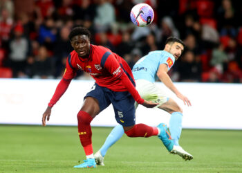 ADELAIDE, AUSTRALIA - OCTOBER 29: Musa Toure of United goes for the ball during the A-League Men round two match between Adelaide United and Melbourne City at Coopers Stadium, on October 29, 2023, in Adelaide, Australia. (Photo by Kelly Barnes/Getty Images)