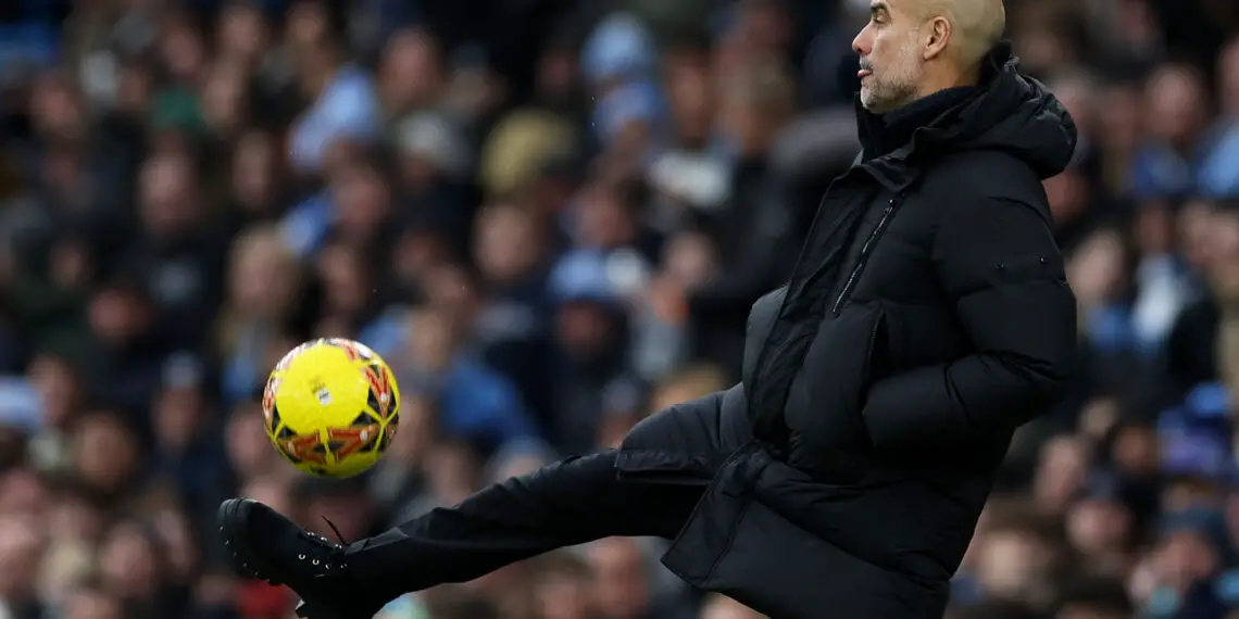 MANCHESTER, ENGLAND - JANUARY 07: Pep Guardiola, Manager of Manchester City, controls the ball during the Emirates FA Cup Third Round match between Manchester City and Huddersfield Town at Etihad Stadium on January 07, 2024 in Manchester, England. (Photo by Clive Brunskill/Getty Images)