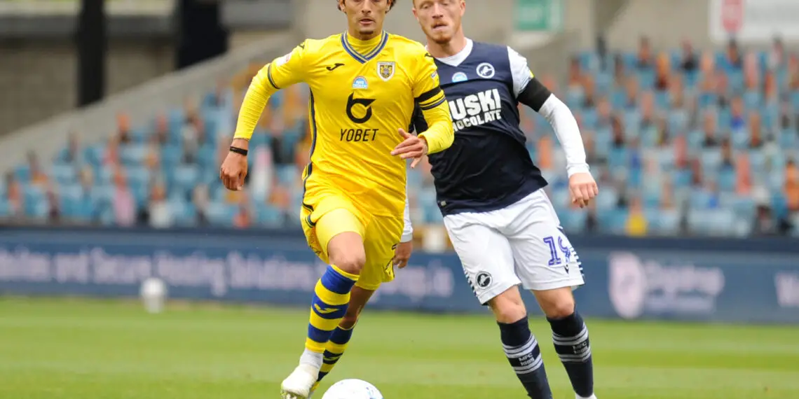 LONDON, ENGLAND - JUNE 30: Yan Dhanda of Swansea City runs past Ryan Woods of Millwall during the Sky Bet Championship match between Millwall and Swansea City at The Den on June 30, 2020 in London, England. (Photo by Alex Burstow/Getty Images)