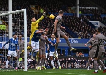 Tottenham Hotspur's Italian goalkeeper #13 Guglielmo Vicario saves a shot on goal during the English Premier League football match between Everton and Tottenham Hotspur at Goodison Park in Liverpool, northwest England, on February 3, 2024. (Photo by Paul ELLIS / AFP)