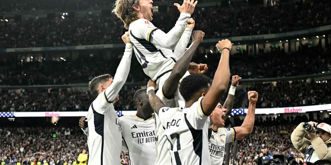 Real Madrid's Croatian midfielder #10 Luka Modric celebrates scoring his team first goal during the Spanish league football match between Real Madrid CF and Sevilla FC at the Santiago Bernabeu stadium in Madrid on February 25, 2024. (Photo by JAVIER SORIANO / AFP) (Photo by JAVIER SORIANO/AFP via Getty Images)