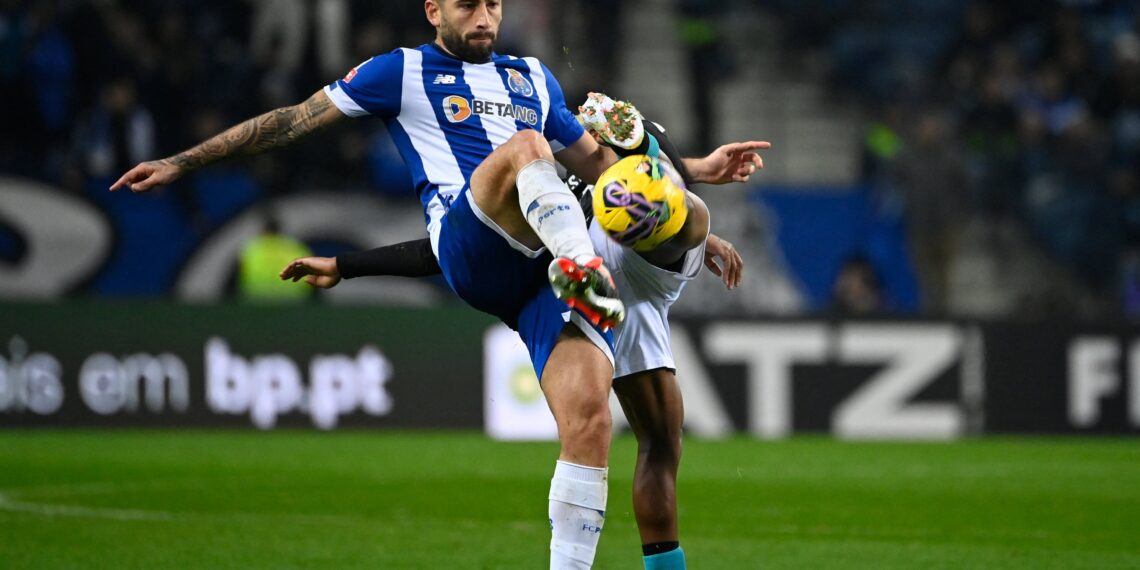 FC Porto's Argentine midfielder #22 Alan Varela kicks the ball during the Portuguese League football match between FC Porto and Moreirense FC at the Dragao stadium in Porto on January 20, 2024. (Photo by MIGUEL RIOPA / AFP) (Photo by MIGUEL RIOPA/AFP via Getty Images)