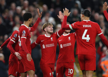 LIVERPOOL, ENGLAND - FEBRUARY 21: Virgil van Dijk (4) of Liverpool celebrates with team mate Harvey Elliott after he has scored the teams first goal during the Premier League match between Liverpool FC and Luton Town at Anfield on February 21, 2024 in Liverpool, England. (Photo by Clive Brunskill/Getty Images)