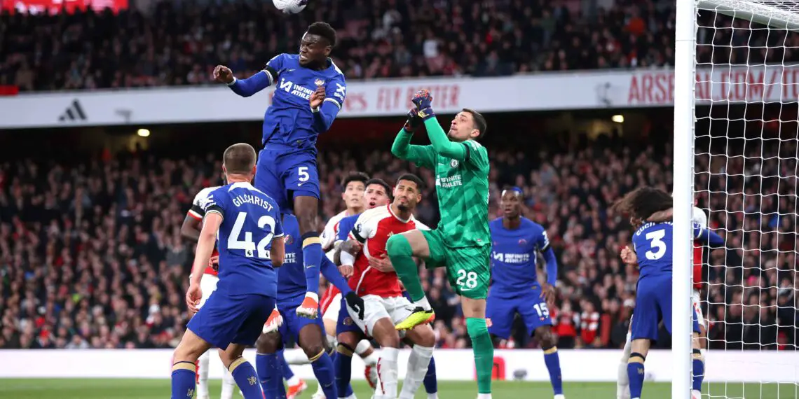 LONDON, ENGLAND - APRIL 23: Benoit Badiashile of Chelsea clears a corner during the Premier League match between Arsenal FC and Chelsea FC at Emirates Stadium on April 23, 2024 in London, England. (Photo by Alex Pantling/Getty Images)