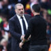 Tottenham Hotspur Head Coach Ange Postecoglou (L) shakes hands with Arsenal's manager Mikel Arteta (R)