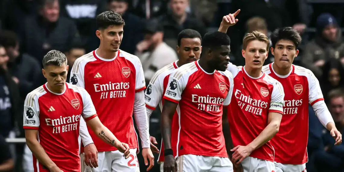Arsenal's German midfielder #29 Kai Havertz (2nd L) celebrates with teammates after scoring his team third goal during the English Premier League football match between Tottenham Hotspur and Arsenal at the Tottenham Hotspur Stadium in London, on April 28, 2024. (Photo by Ben Stansall / AFP)
