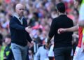Arsenal's Spanish manager Mikel Arteta (R) and Manchester United's Dutch manager Erik ten Hag