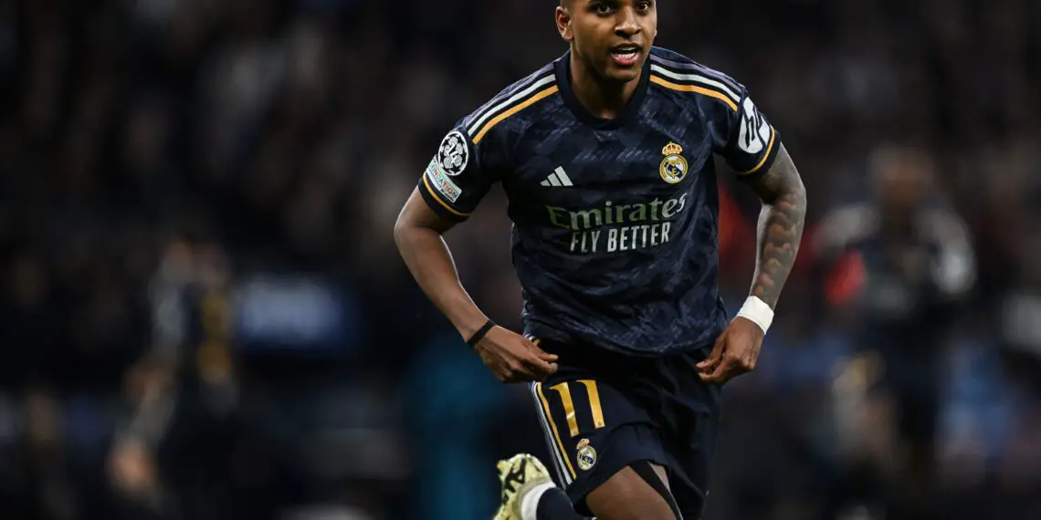 Real Madrid's Brazilian forward #11 Rodrygo celebrates after scoring his team first goal during the UEFA Champions League quarter-final second-leg football match between Manchester City and Real Madrid, at the Etihad Stadium, in Manchester, north-west England, on April 17, 2024. (Photo by Paul ELLIS / AFP) (Photo by PAUL ELLIS/AFP via Getty Images)