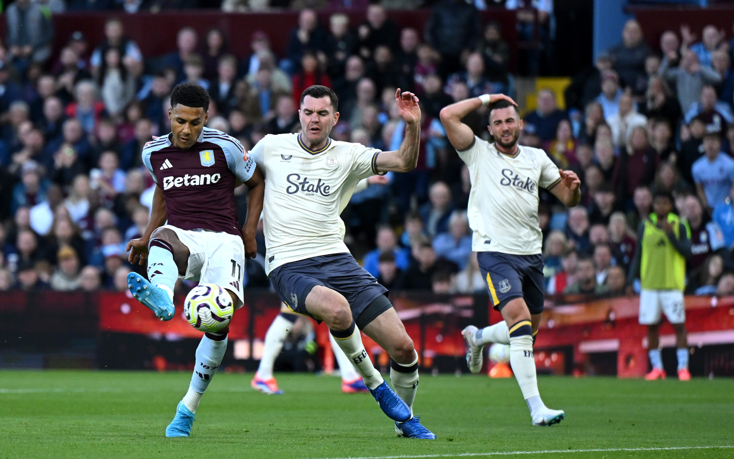 Aston Villa forward Ollie Watkins scores a goal against Everton