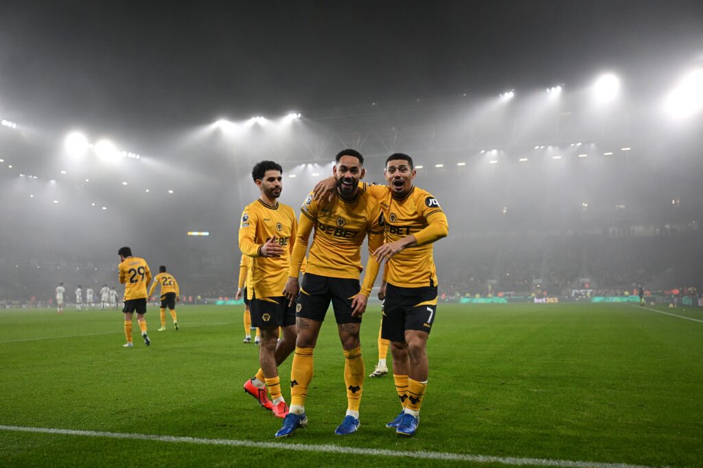 WOLVERHAMPTON, ENGLAND - DECEMBER 26: Matheus Cunha of Wolverhampton Wanderers celebrates scoring his team's first goal with teammates during the Premier League match between Wolverhampton Wanderers FC and Manchester United FC at Molineux on December 26, 2024 in Wolverhampton, England. (Photo by Shaun Botterill/Getty Images)
