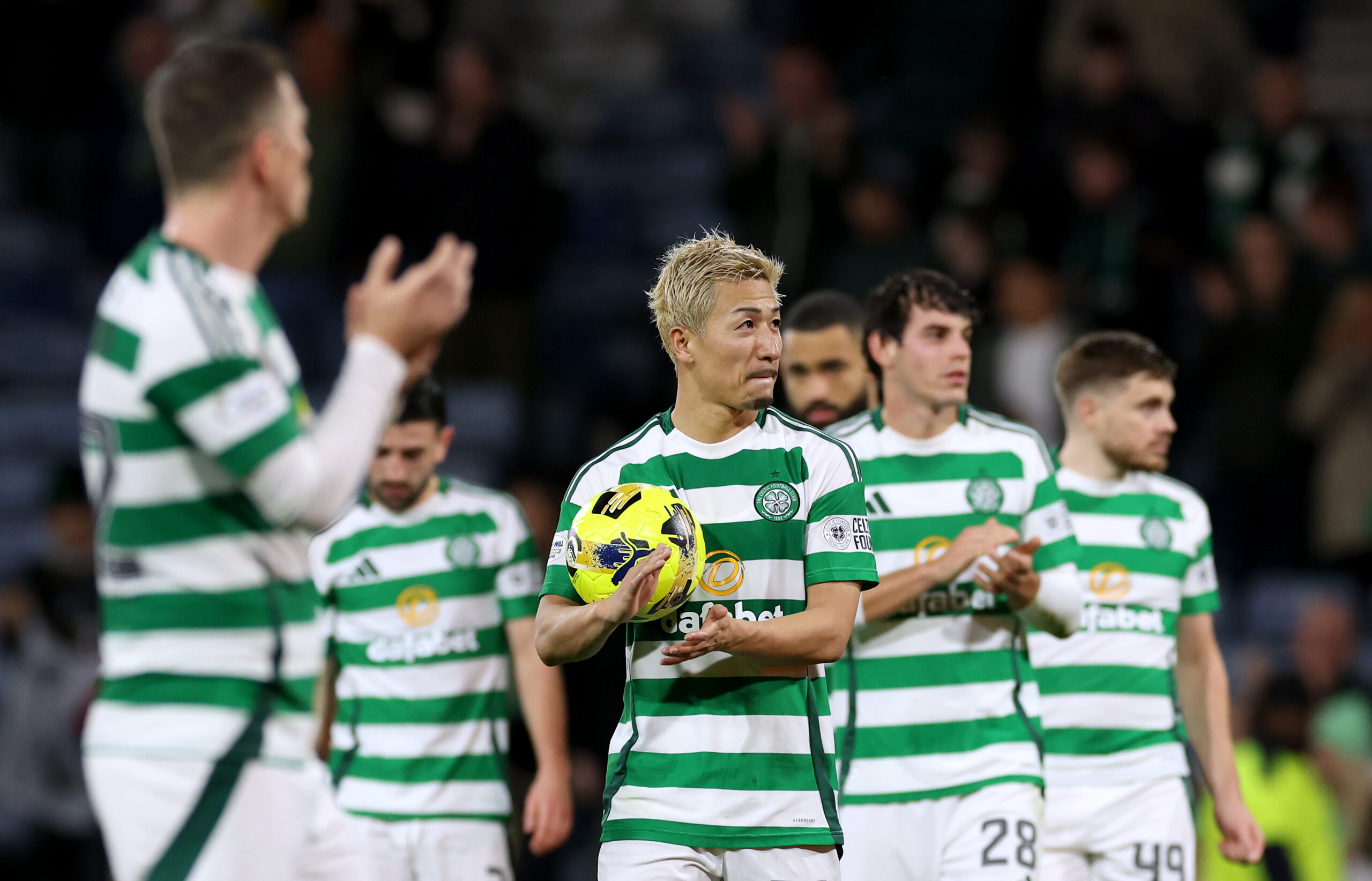Celtic players celebrate their win against Aberdeen