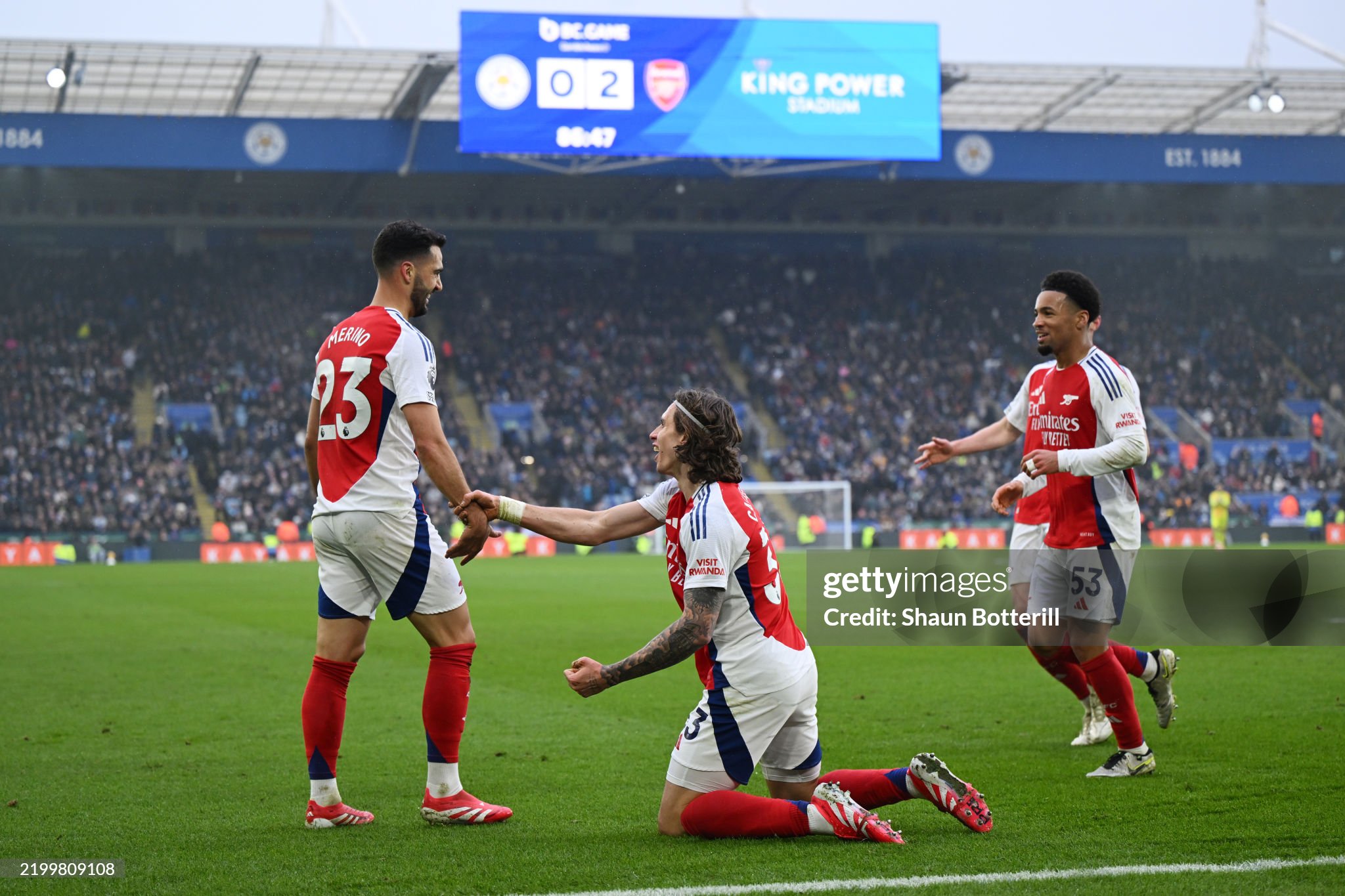 Arsenal players celebrate a goal