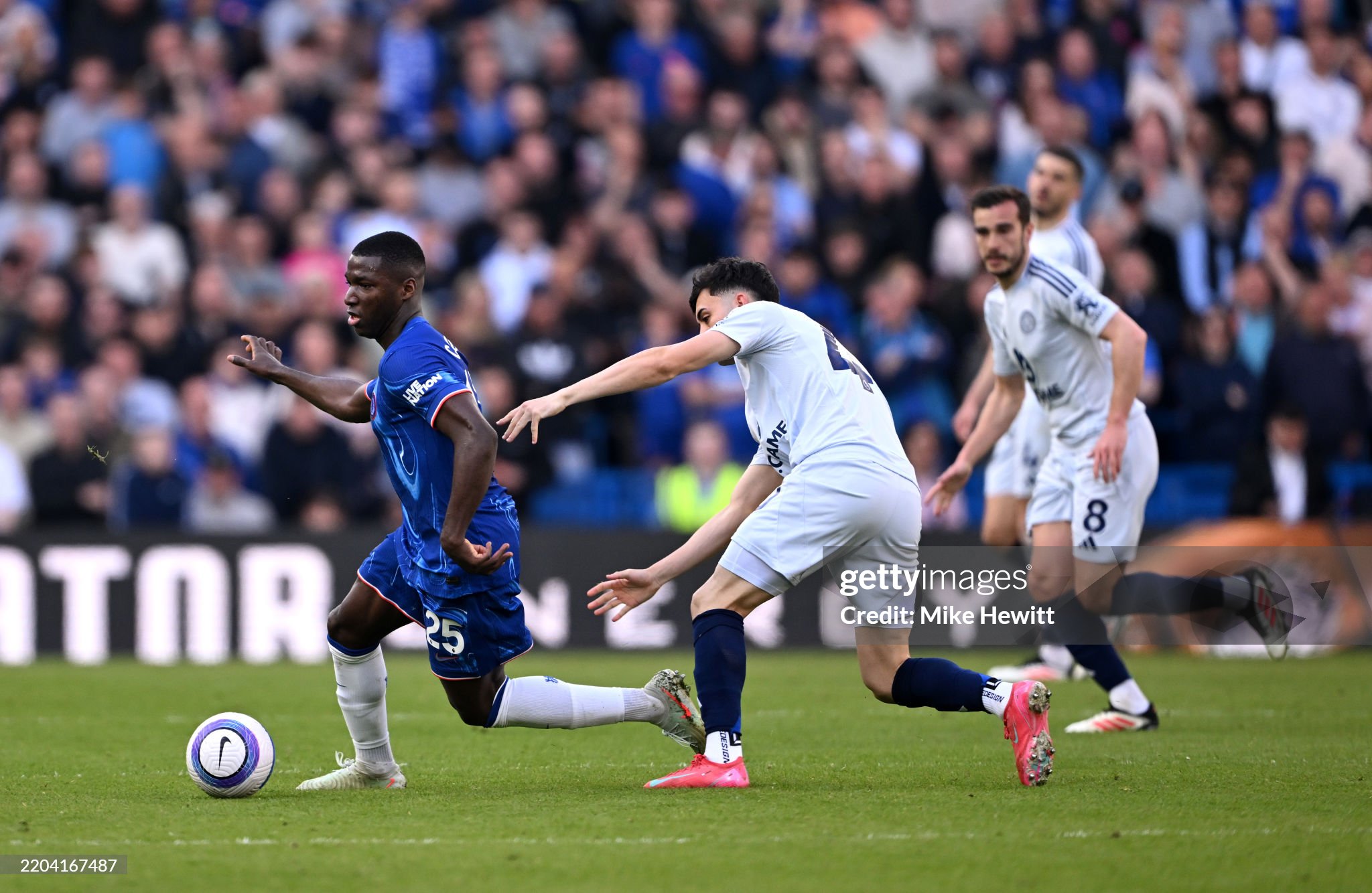 Chelsea midfielder Moises Caicedo drawing a foul