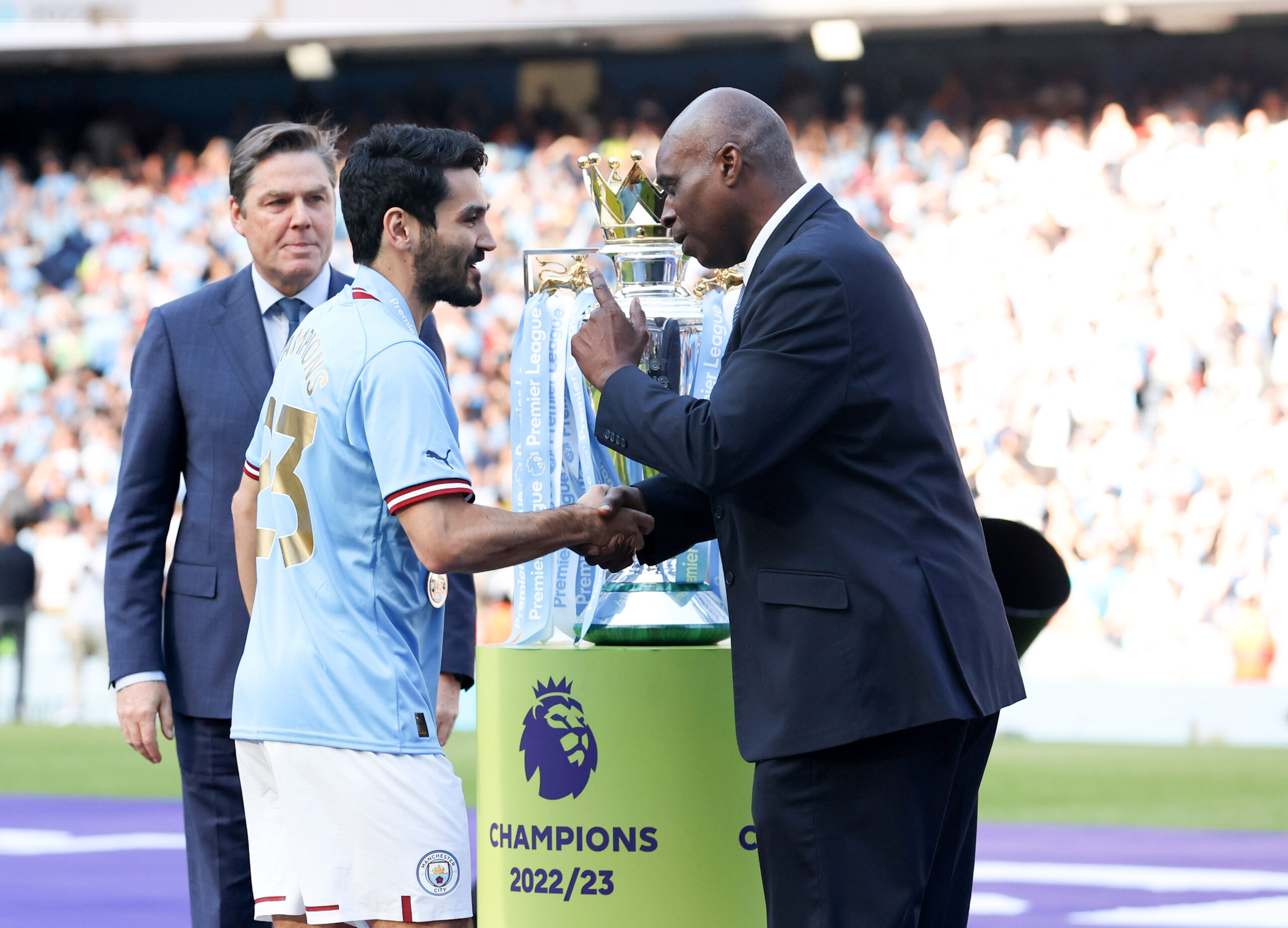 Manchester City midfielder Ilkay Gundogan shakes hand