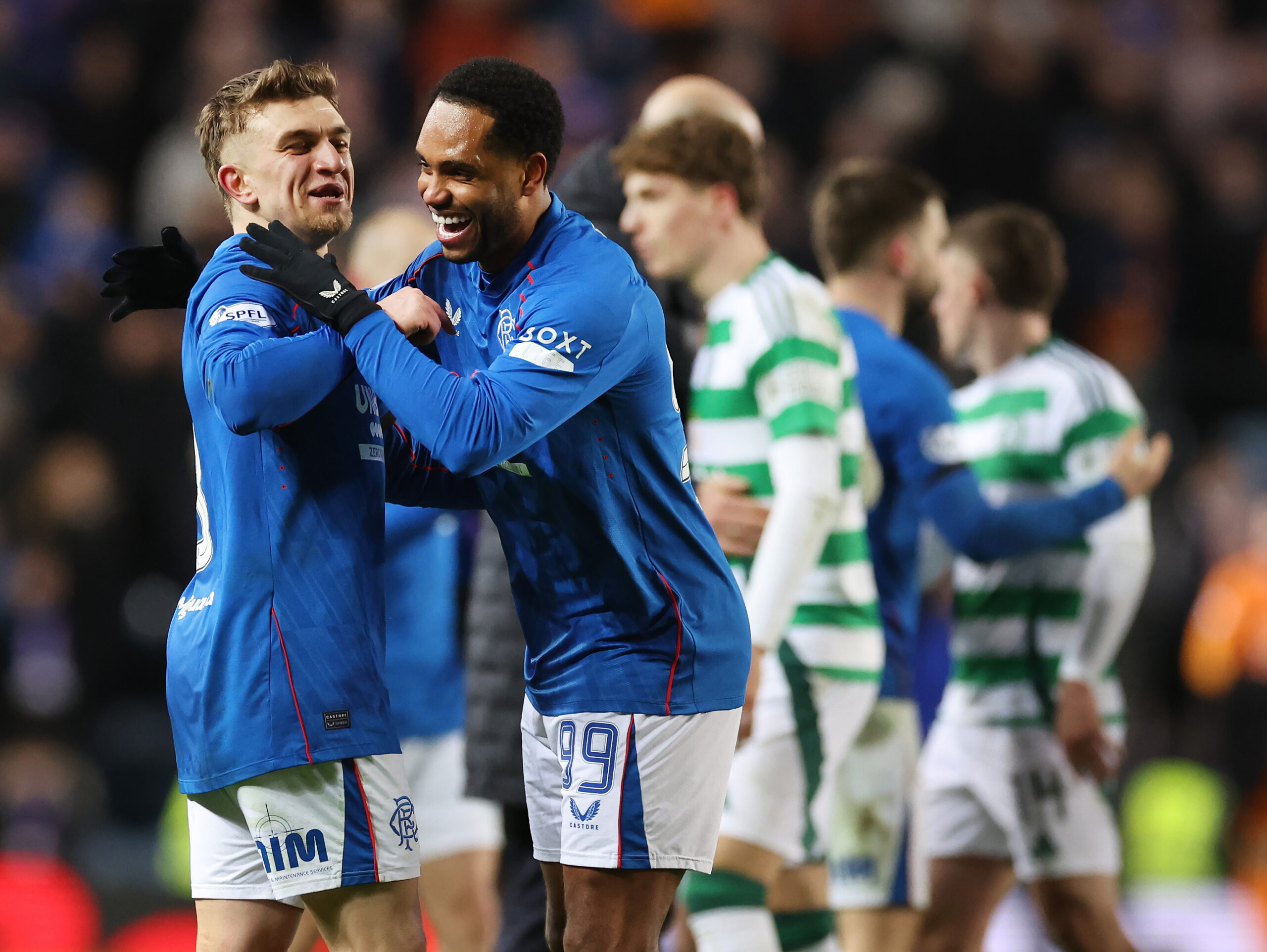 Rangers players Ridvan Yilmaz and Danilo celebrate their win against Celtic