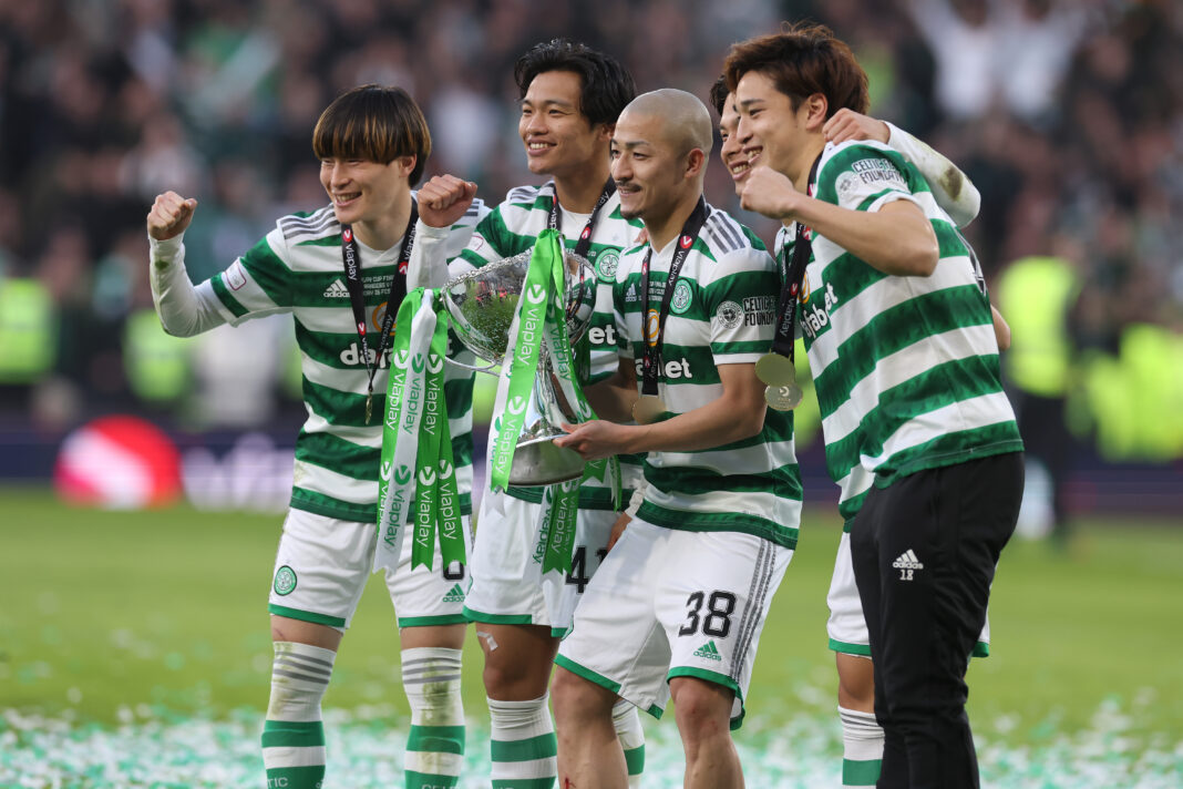 The Japanese stars of Celtic celebrate the league win