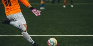 The Growing Influence Of Sports Data On Modern Football Coverage A goalkeeper kicking a football