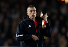 AC Milan Prepare Offer For Real Madrid Star: The Rumoured Price Tag A Mistake For Los Blancos? Real Madrid goalkeeper Andriy Lunin standing on the pitch during a match.