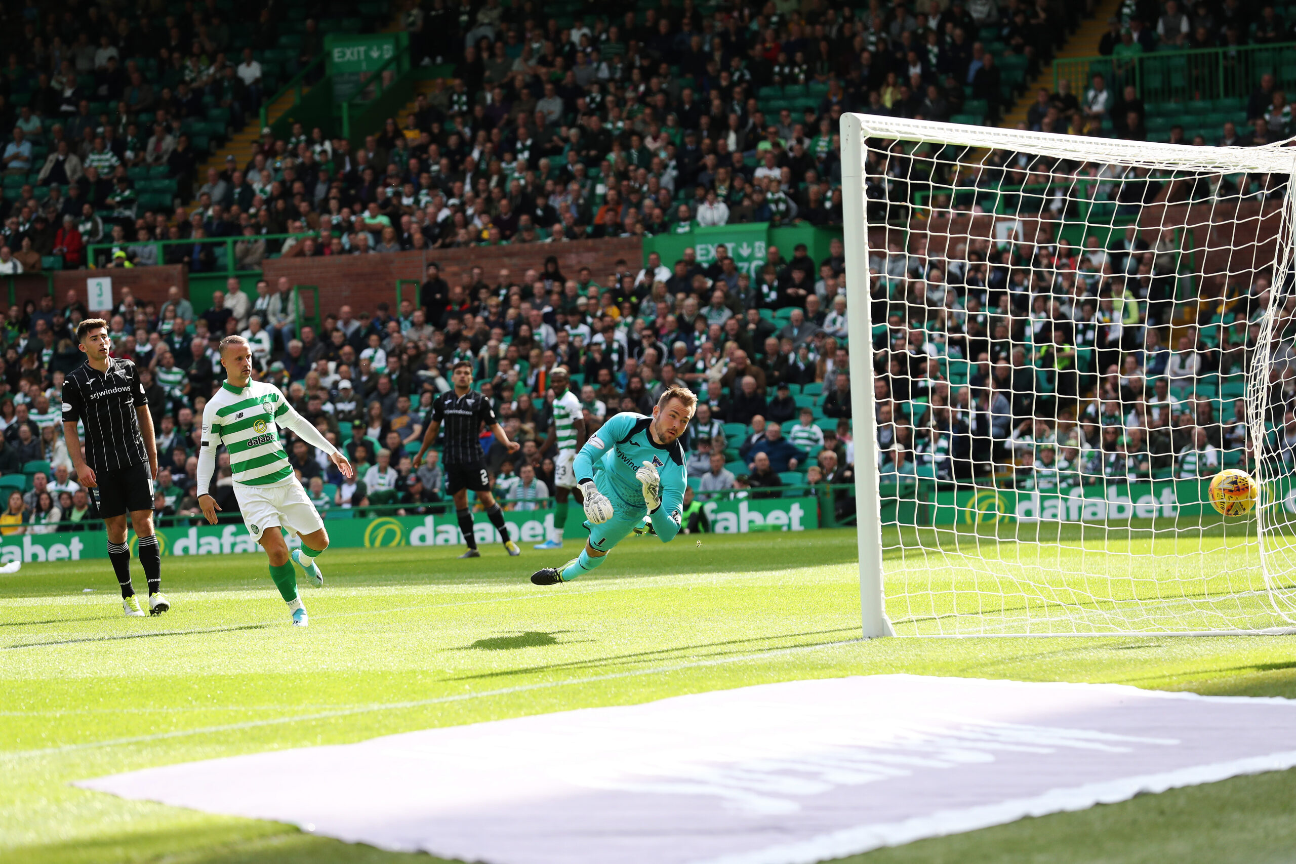Celtic and Dunfermline in action in a League Cup match