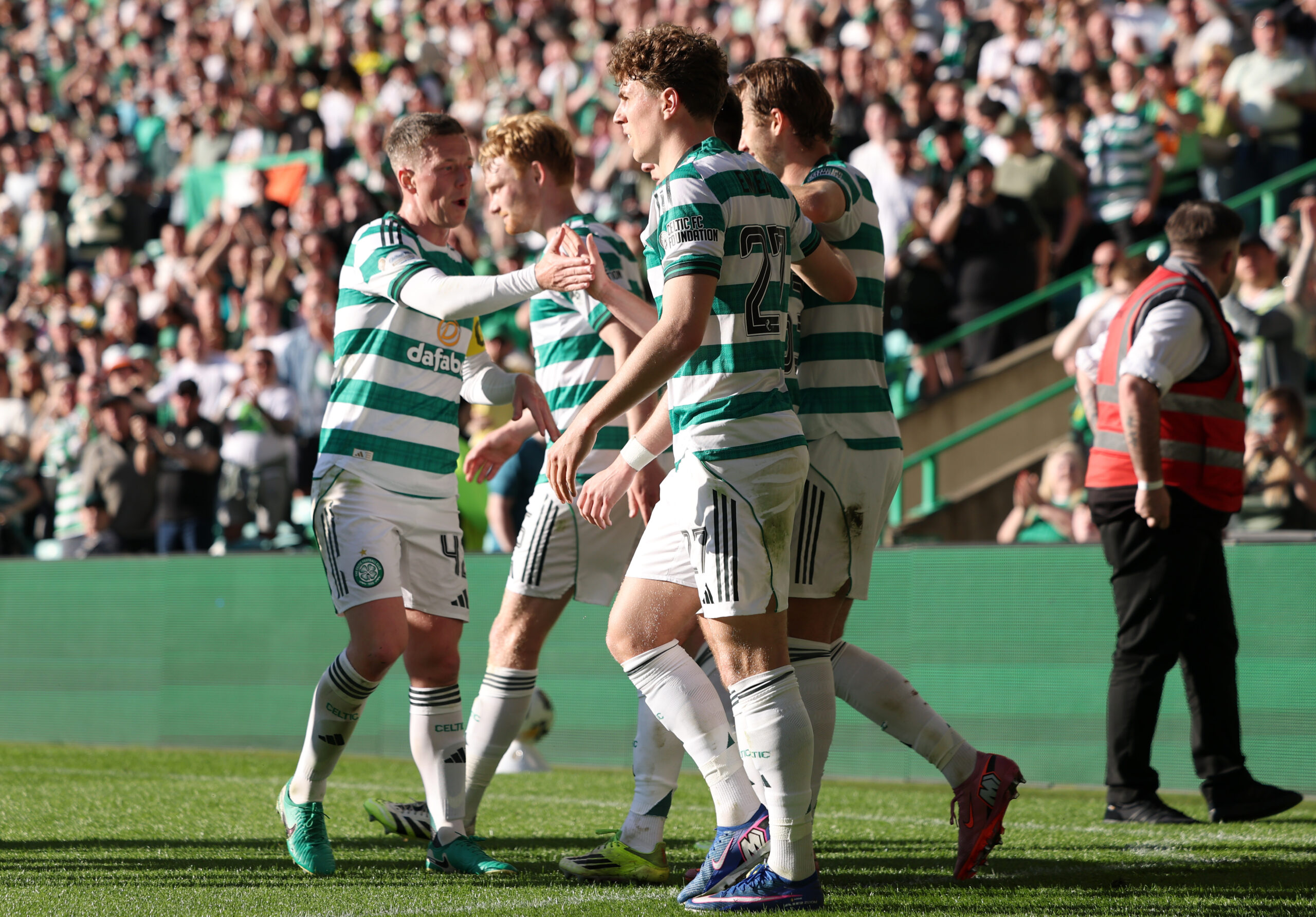 Celtic players celebrate a goal